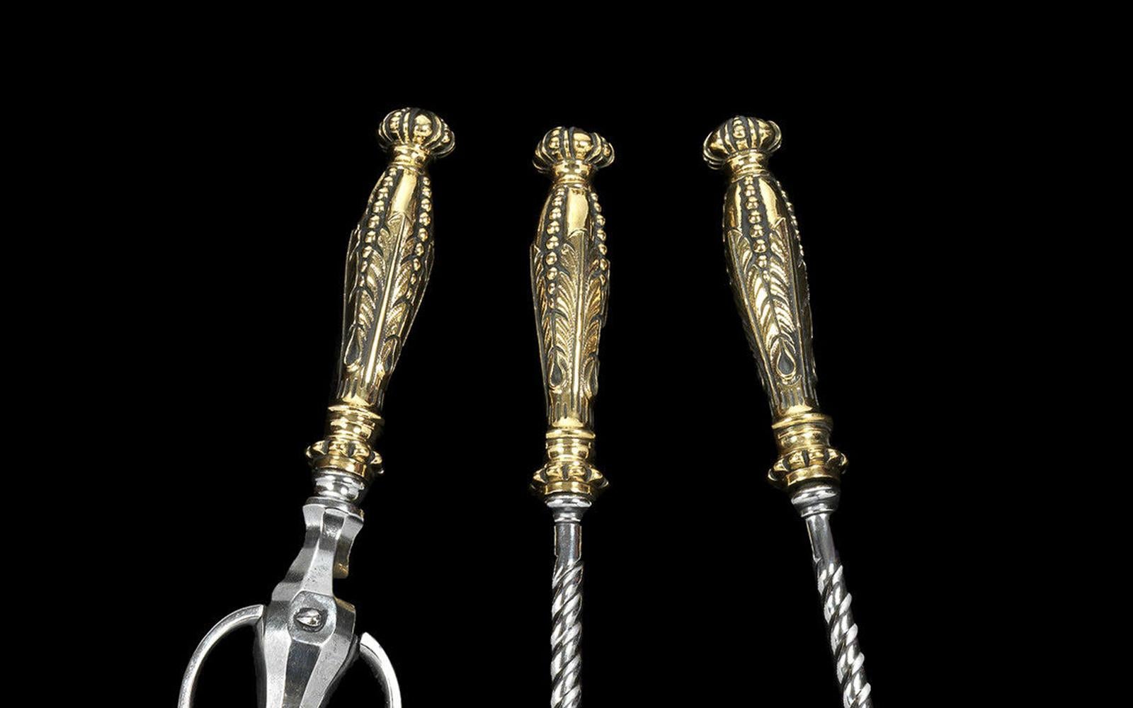 With elaborate brass knob handles and twisted steel stems.
   