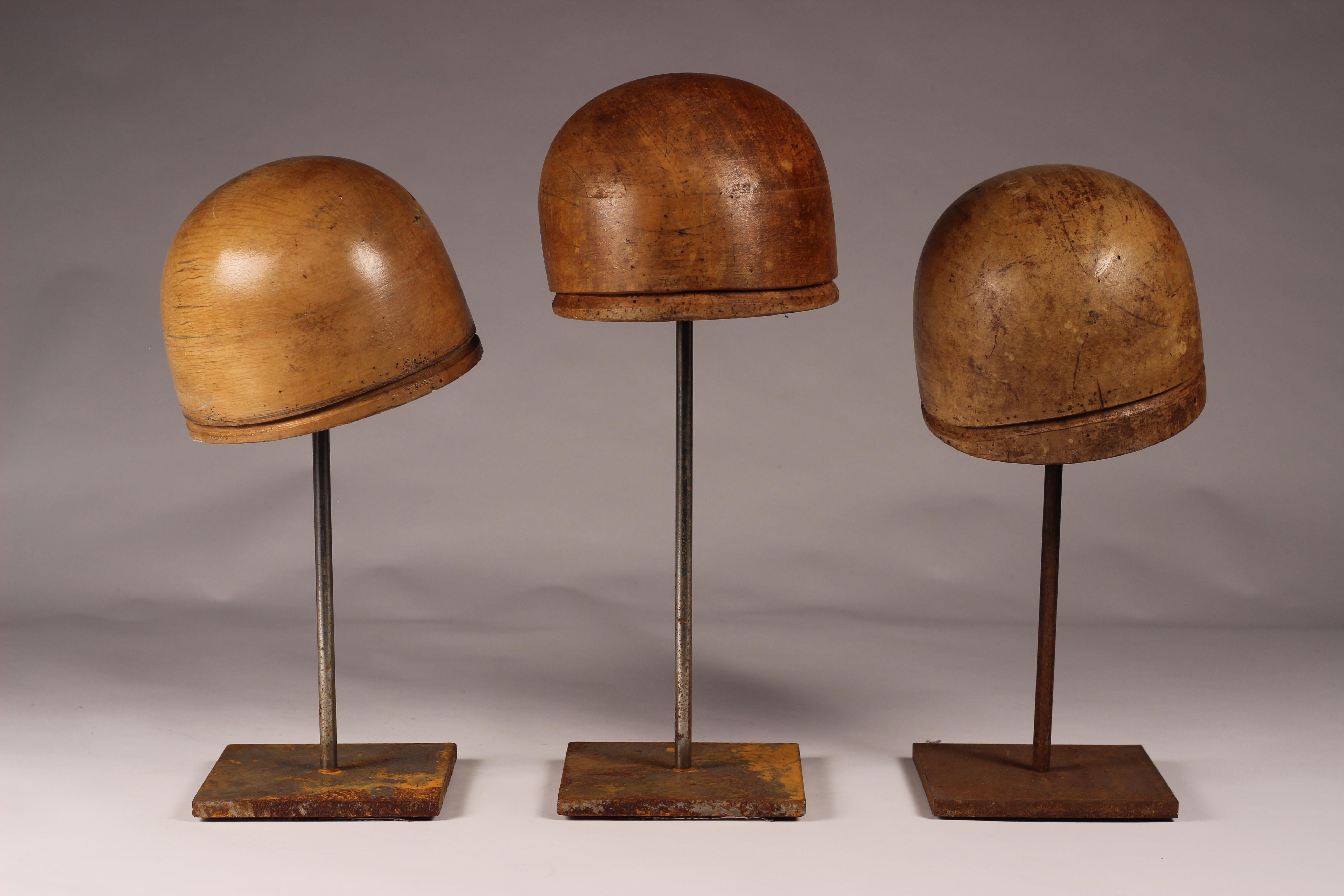 A collection of 3 Milliner hat blocks/molds from the well known hat makers of Florence, Italy. Mounted on a oxidised steel bases with protective Felt bases.