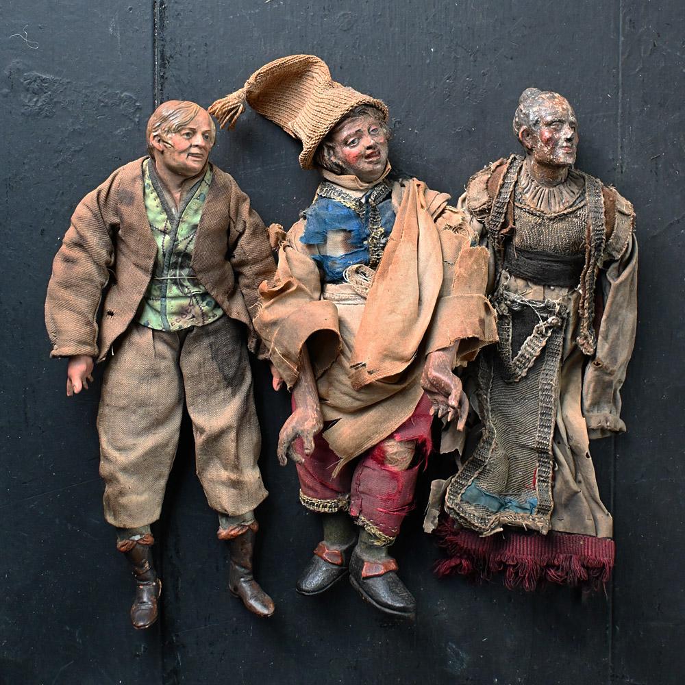 A set of three 19th century terracotta crib figures

A set of three 19th century hand crafted terracotta crib figures. Hand crafted with original cloths still intact if sightly weathered and worn. One figure has an amazing ghostly face resembling