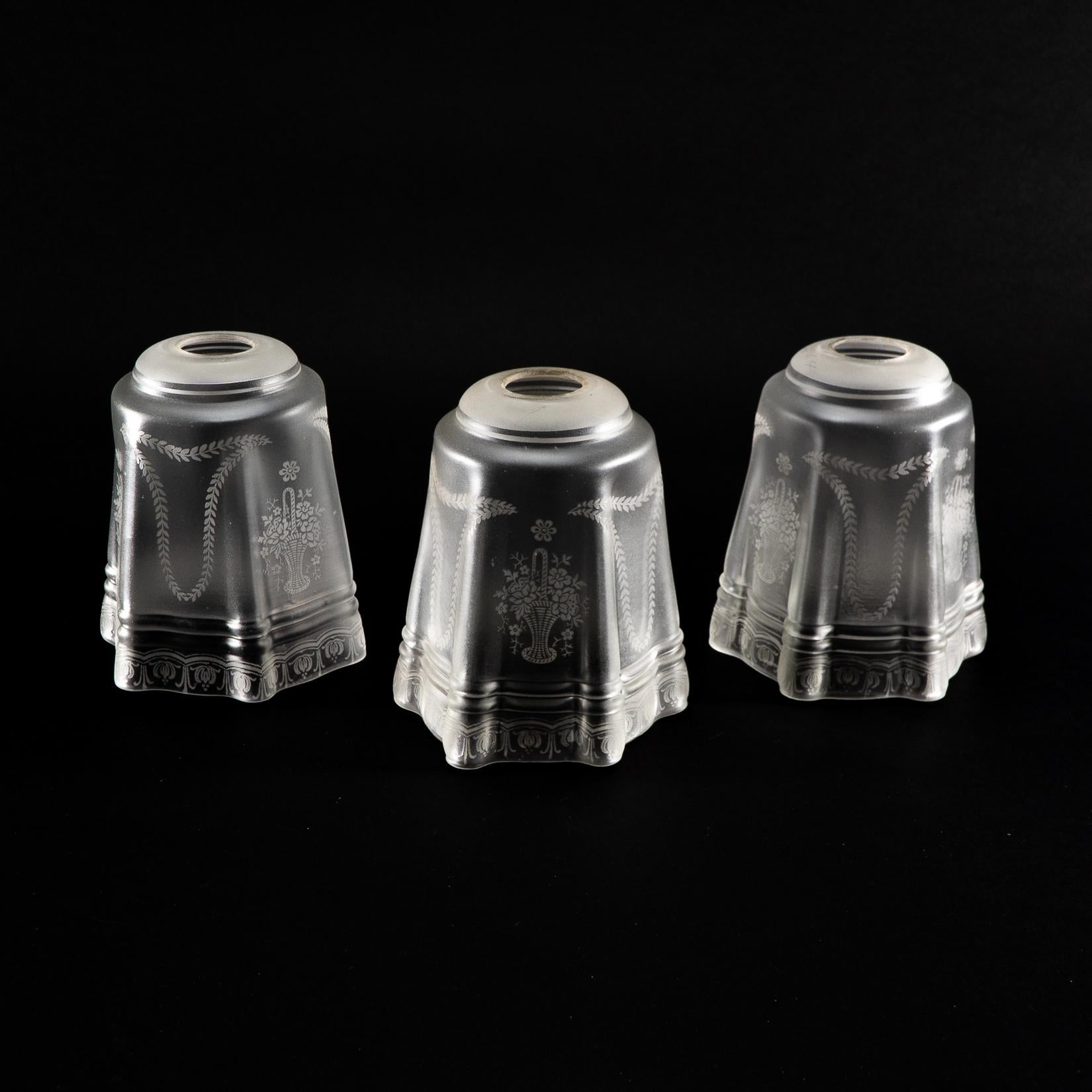 A Set of Three Acid-Etched Frosted Glass Shades
With intricate floral and garland motifs, featuring a tapered square form and decorative banded detailing.
Diameter of a lampshade hole: 3cm/1.18