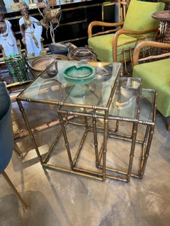A set of three French 1970s faux bamboo gilt metal nest of tables