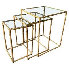 A set of three French 1970s faux bamboo gilt metal nest of tables