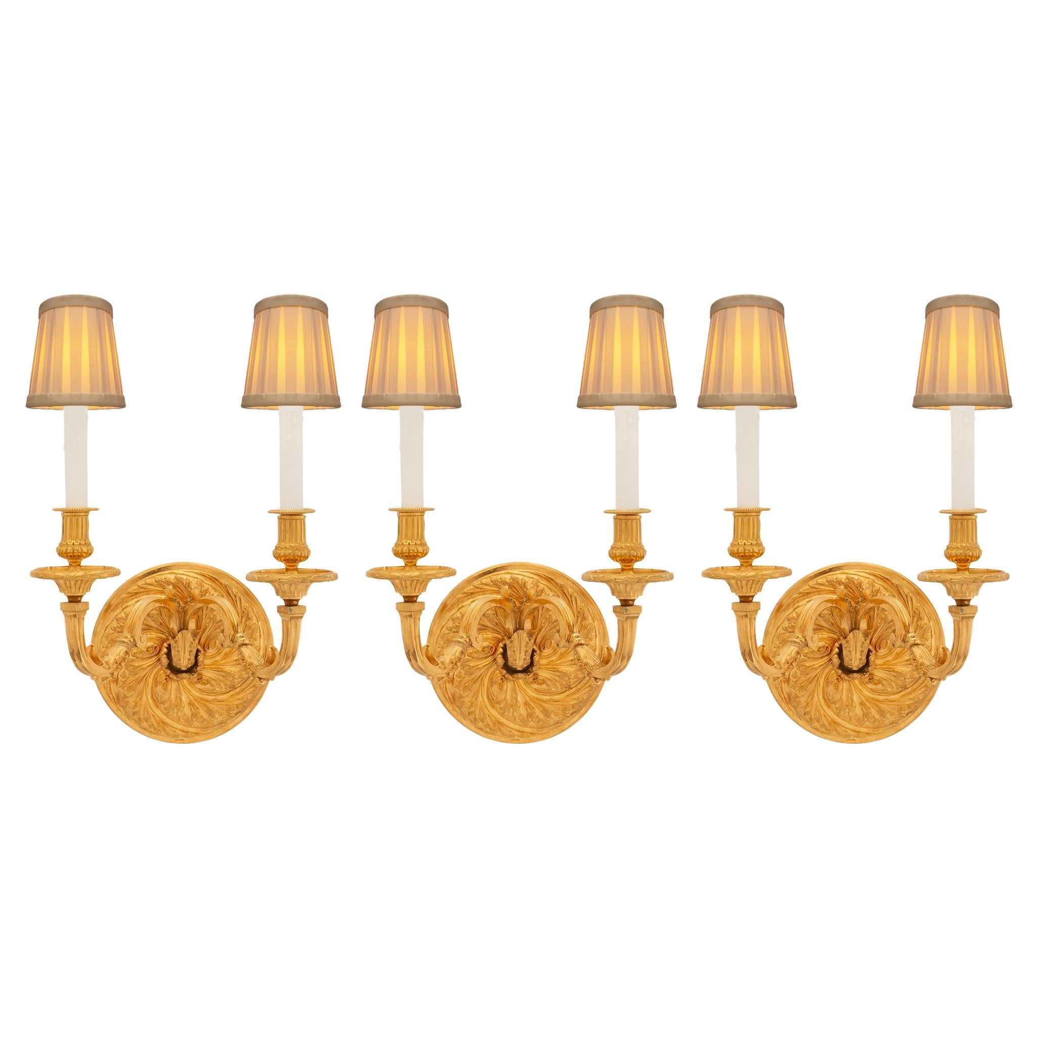A set of three French 19th century Regence st. Ormolu sconces For Sale