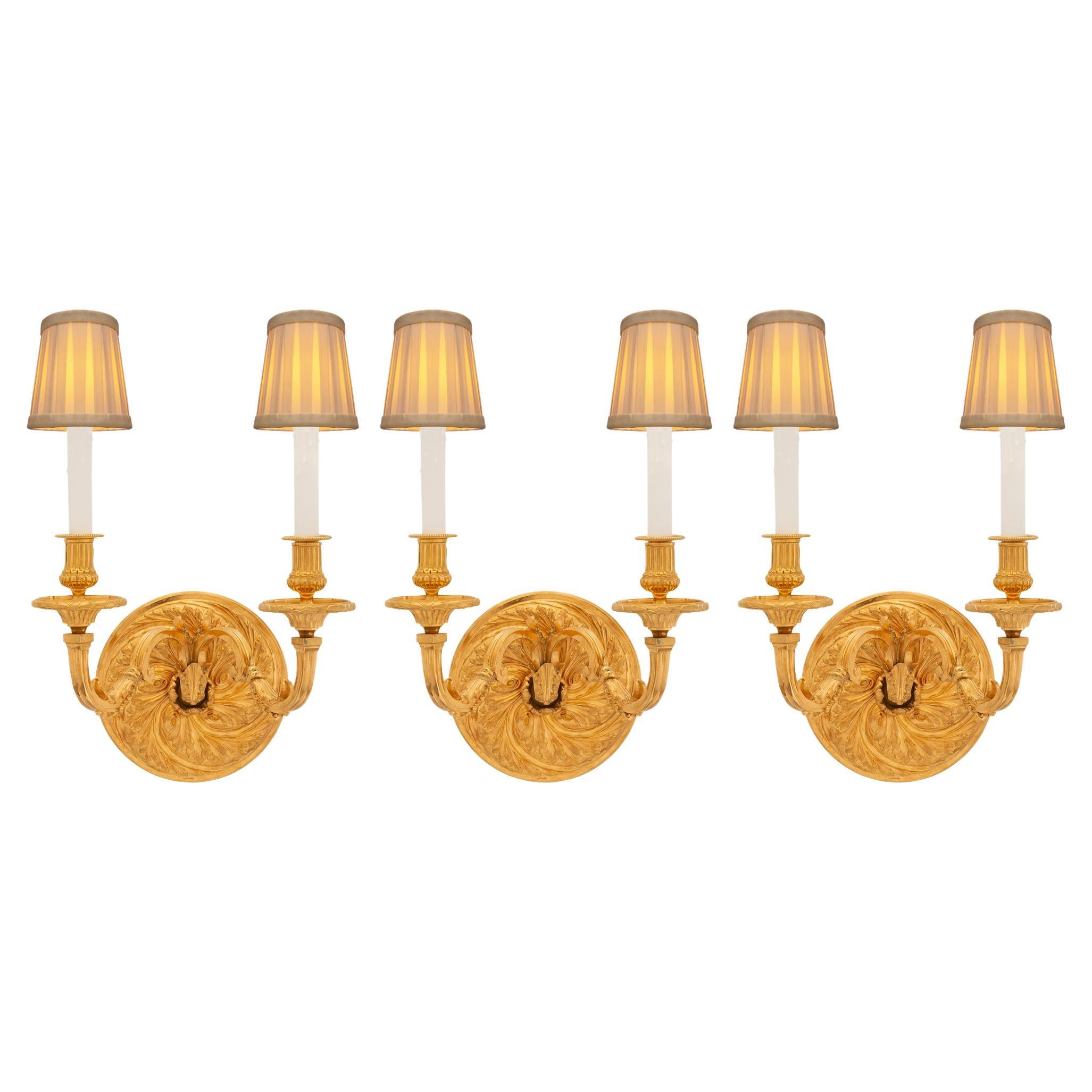 A set of three French 19th century Regence st. Ormolu sconces