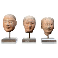 A Set of Three Han Dynasty Funerary Soldier Figure Heads