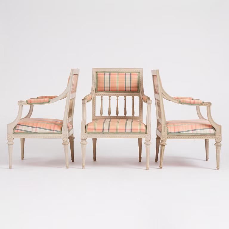 A set of three late Gustavian open armchairs, late 18th century.
This exceptional set of three late Gustavian open armchairs, dating from the late 18th century, exemplifies the graceful, neoclassical style that defined Swedish furniture design