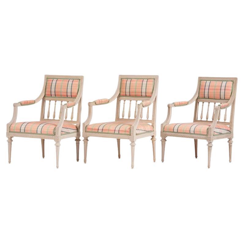 A set of three late Gustavian open armchairs, late 18th century
