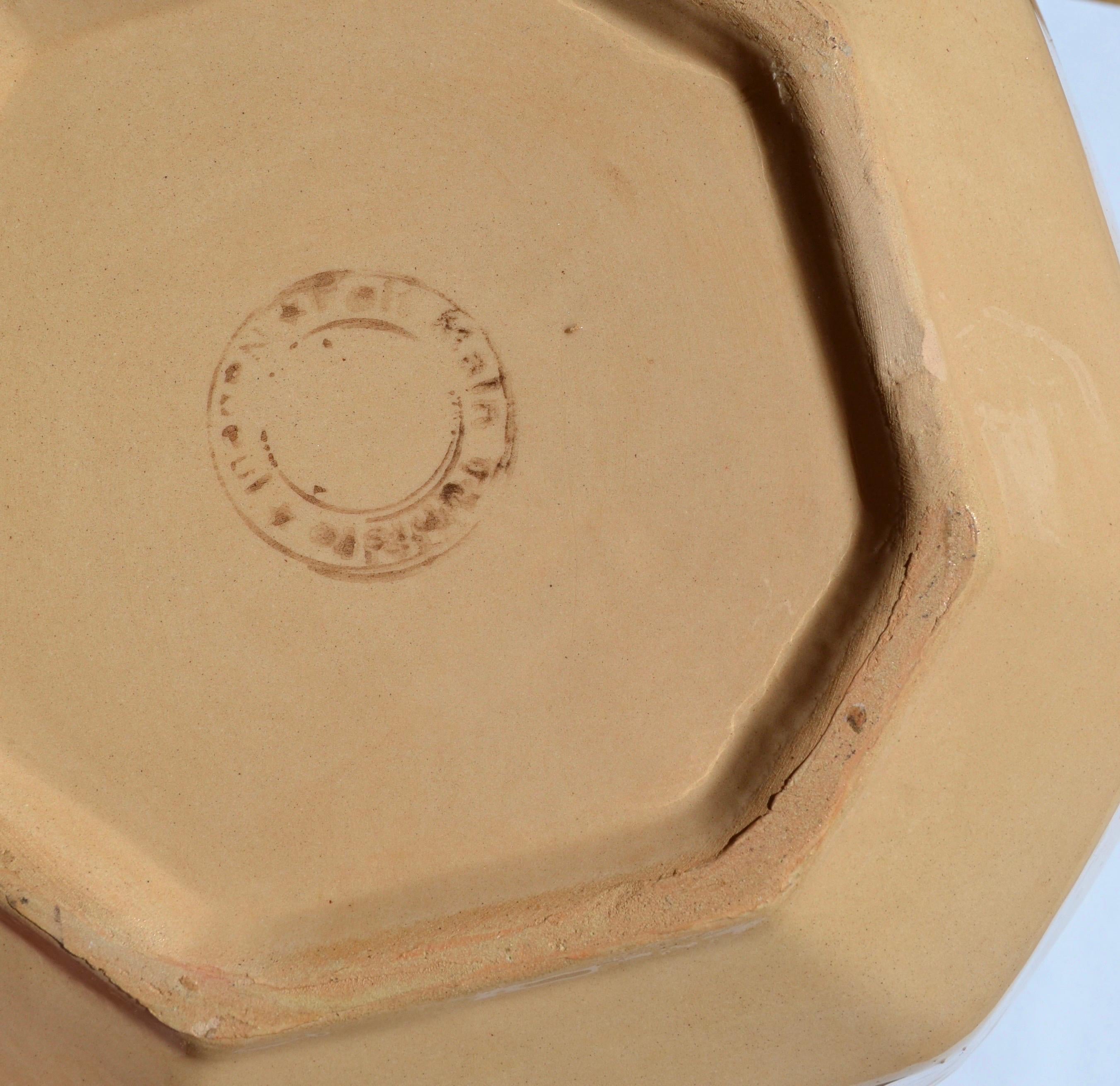 A set of three Moroccan ceramic pieces dating from the mid-20th century, consisting of two octagonal dishes and a trinket tray.

Each piece is adorned with hand-painted enamel featuring traditional geometric patterns, characteristic of Moroccan art.