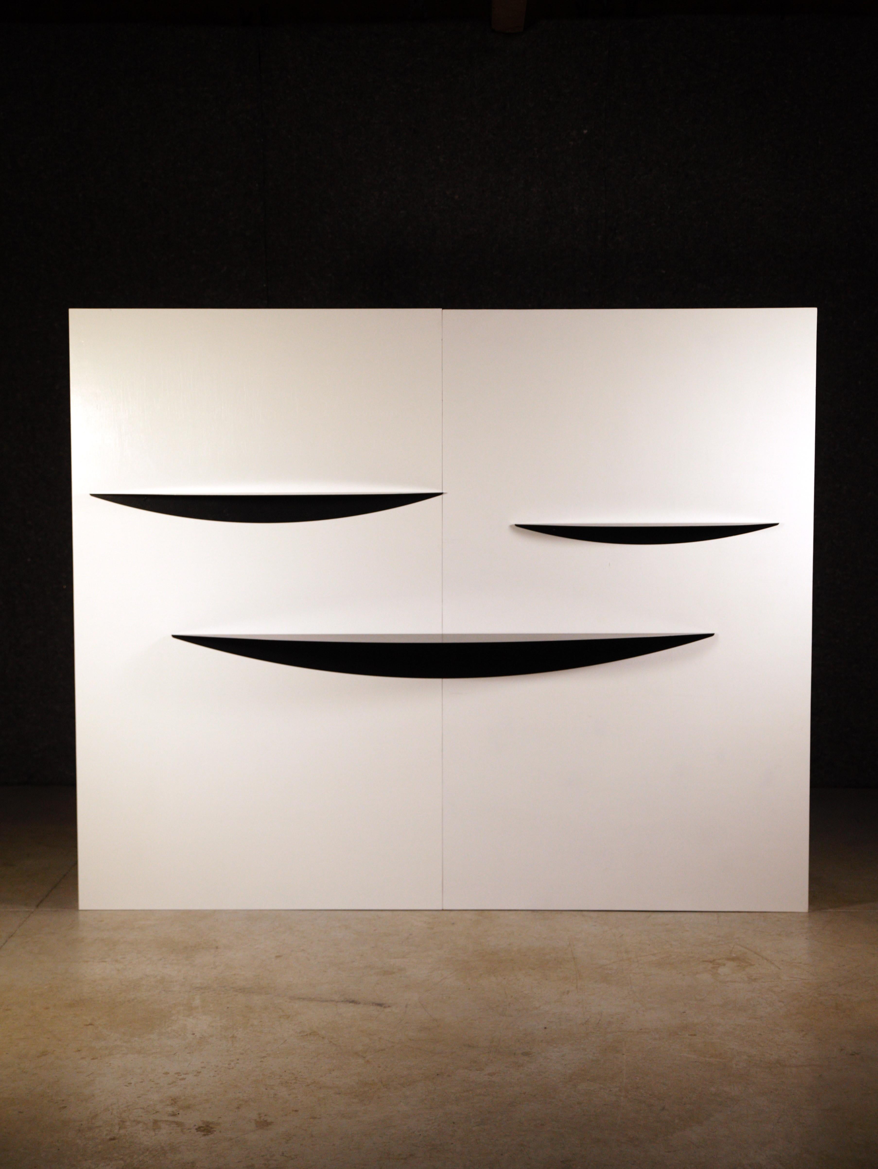 A set of three radical shelves by Gilles Derain.

Black lacquered.

Three différent sizes.

Big : Height : 15cm  Lenght : 180cm  Depht : 25cm

Middle : Height : 10cm  Lenght : 117cm  Depht : 15cm

Small : Height : 7cm   Lenght : 87cm   Depht : 12cm