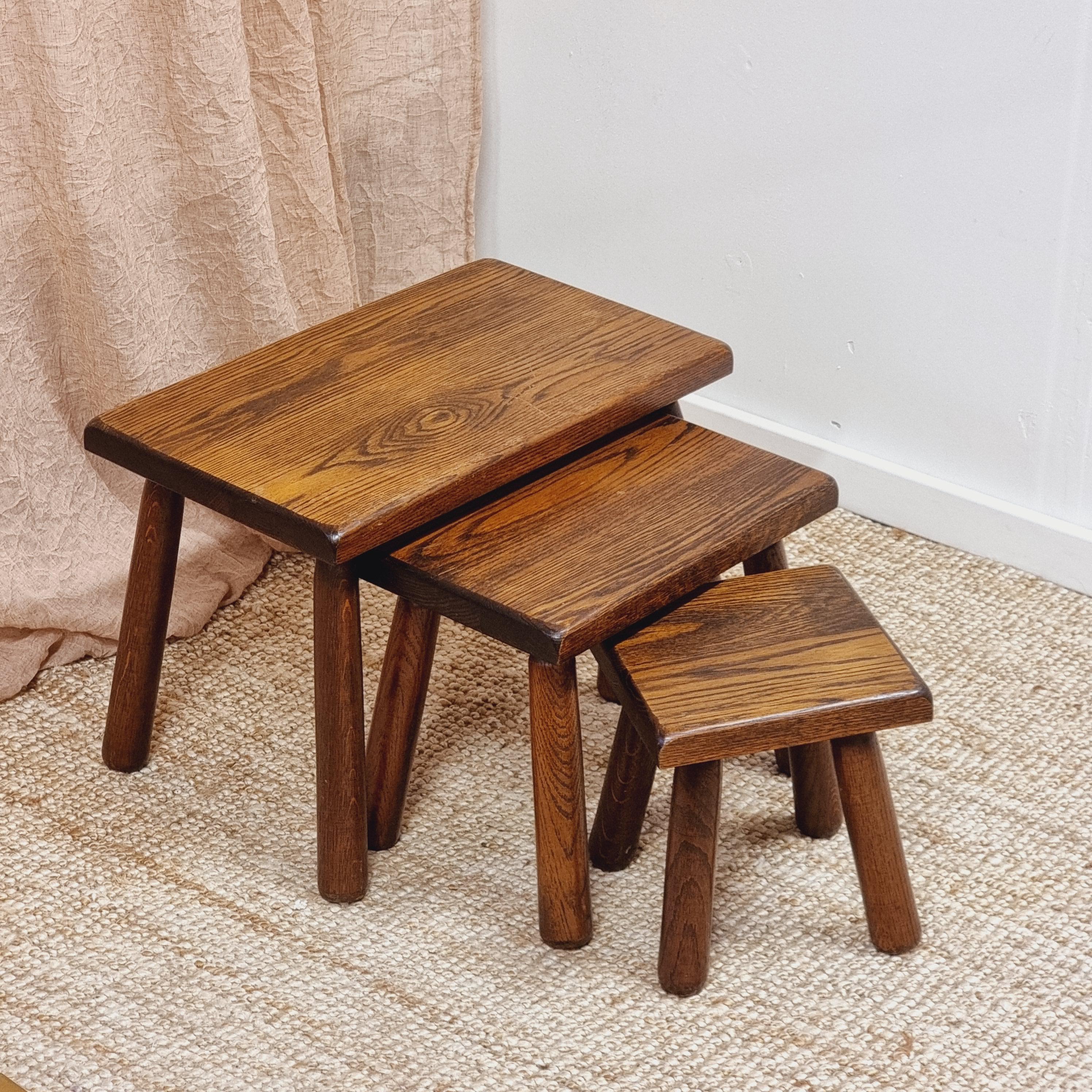 A decorative set of rustic nesting tables, 3 pcs. Made in Sweden, circa 1970s.

In good condition, a few natural cracks in wood (legs) due to age and climate. All three tabled a stable and functional.


