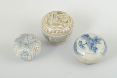 A set of three small lidded jars in glazed tones. Korea, 19th/20th C.