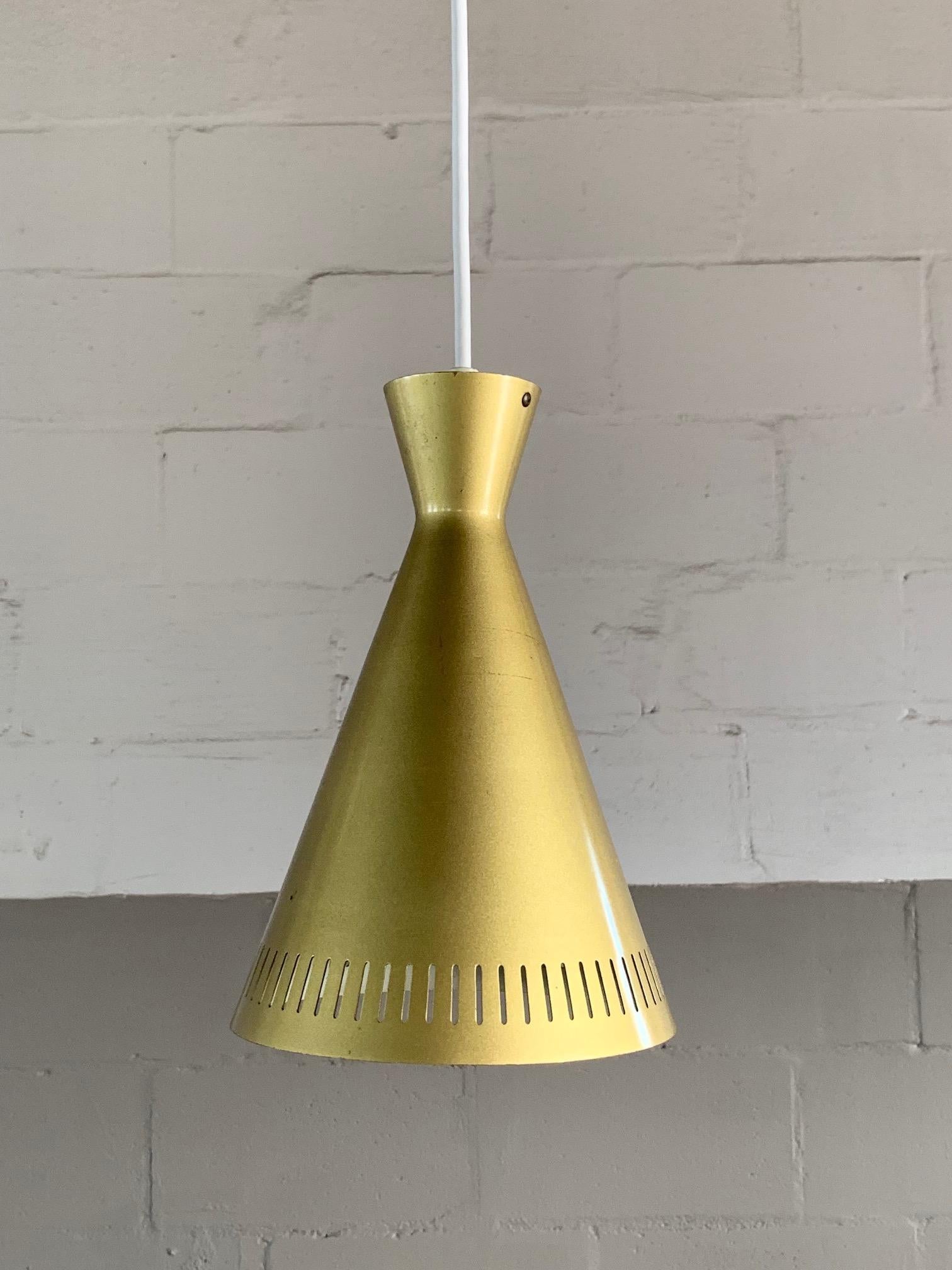 A set of three (3) unusual gold pendant lamps from, Germany, circa 1960s. Rewired for USA. The color is gold/chartreuse/olive. Measuring approximate 10