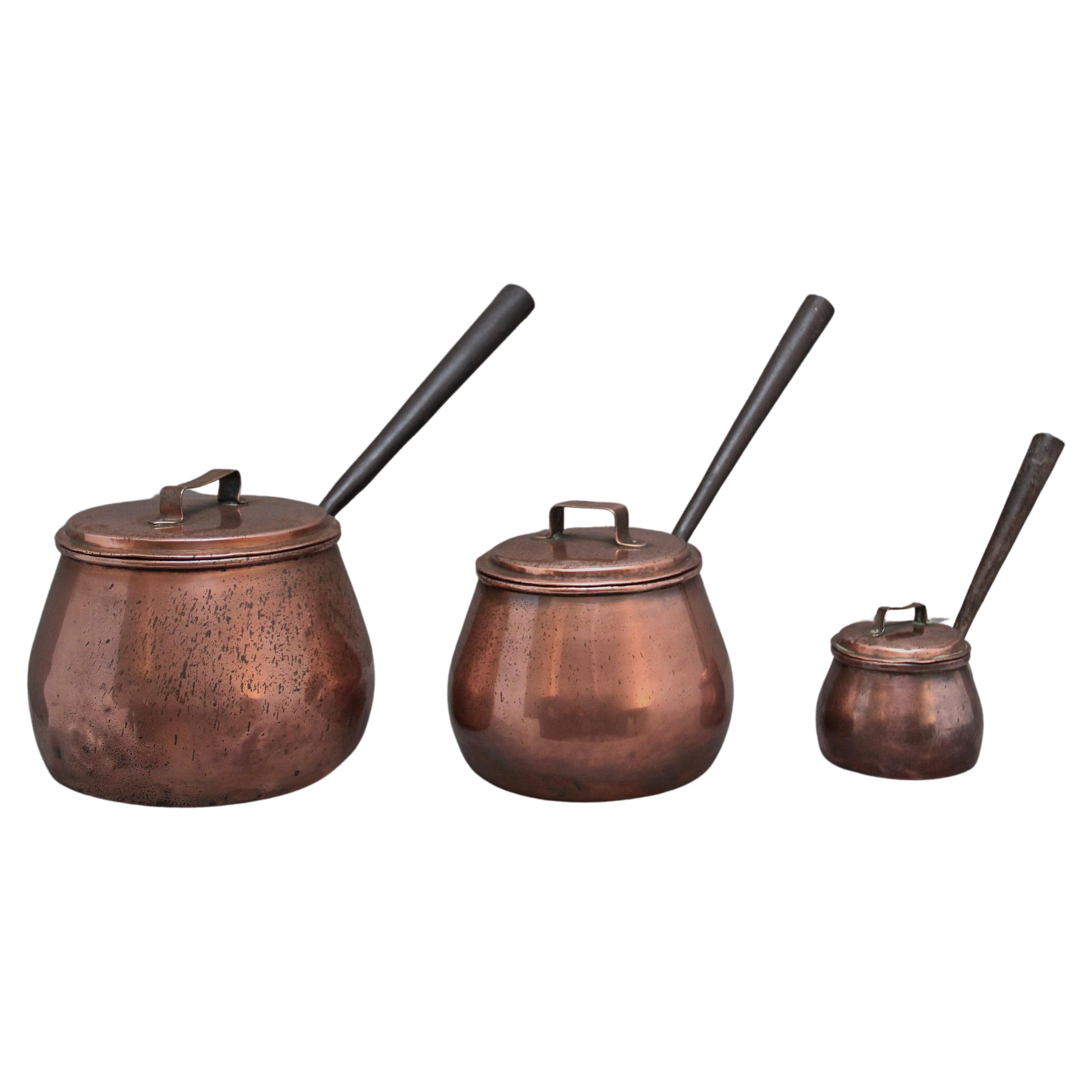 A set of three Victorian copper saucepans For Sale