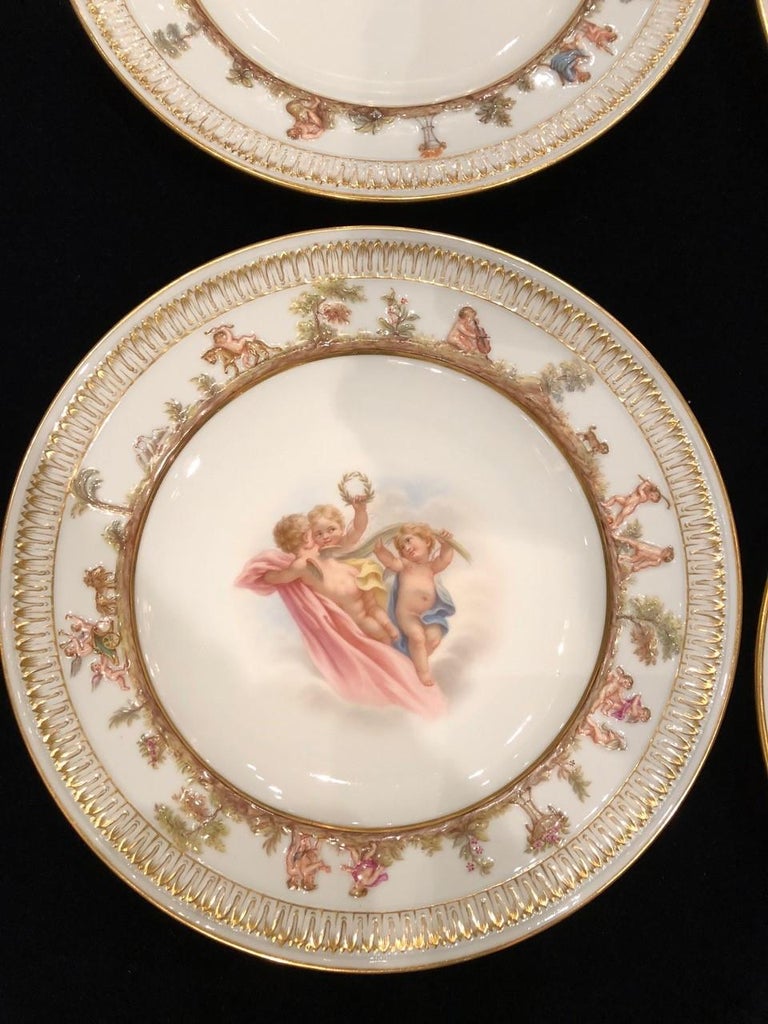 Gilt Set of Twelve Meissen Porcelain Plates with Putti and Heavenly Scenes For Sale