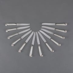 A Set of Twelve Sterling Silver Pistol Grip Knives