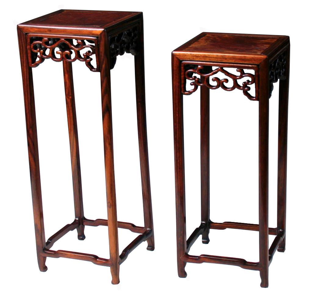 A Set of Two Chinese Rosewood and Burlwood Curio Display Stands, tall pedestal form with thin legs and delicate pierced work apron in a ruyi vine design, elbowed cross stretchers near the base and center burlwood panel, varied in height. Minor signs