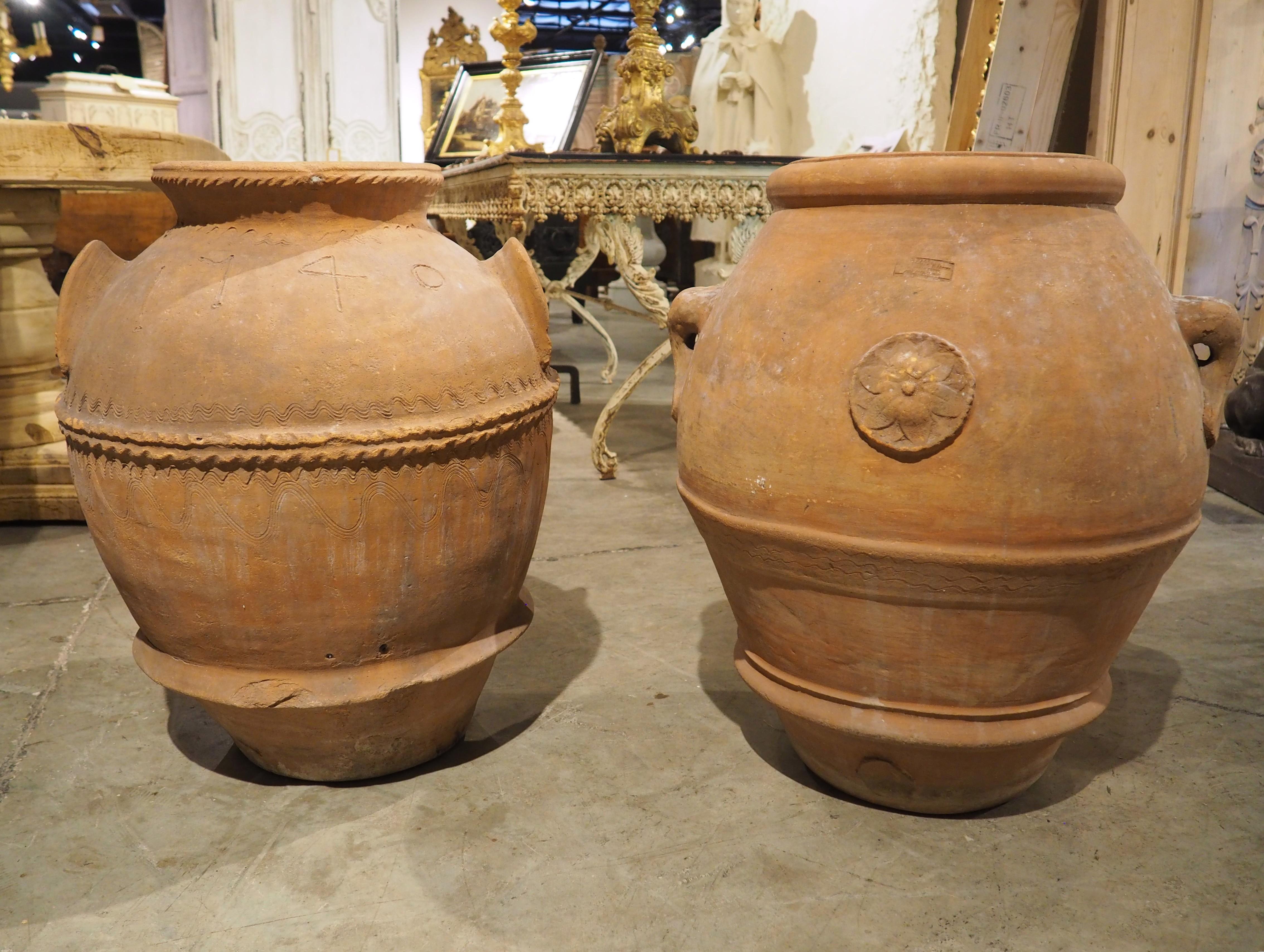More information coming soon…

Dating to the early 1900s, this set of terracotta orcio pots are from Italy.  There are slight variances to the dimensions with different motifs that prevent these from being a true pair, but they look fantastic when
