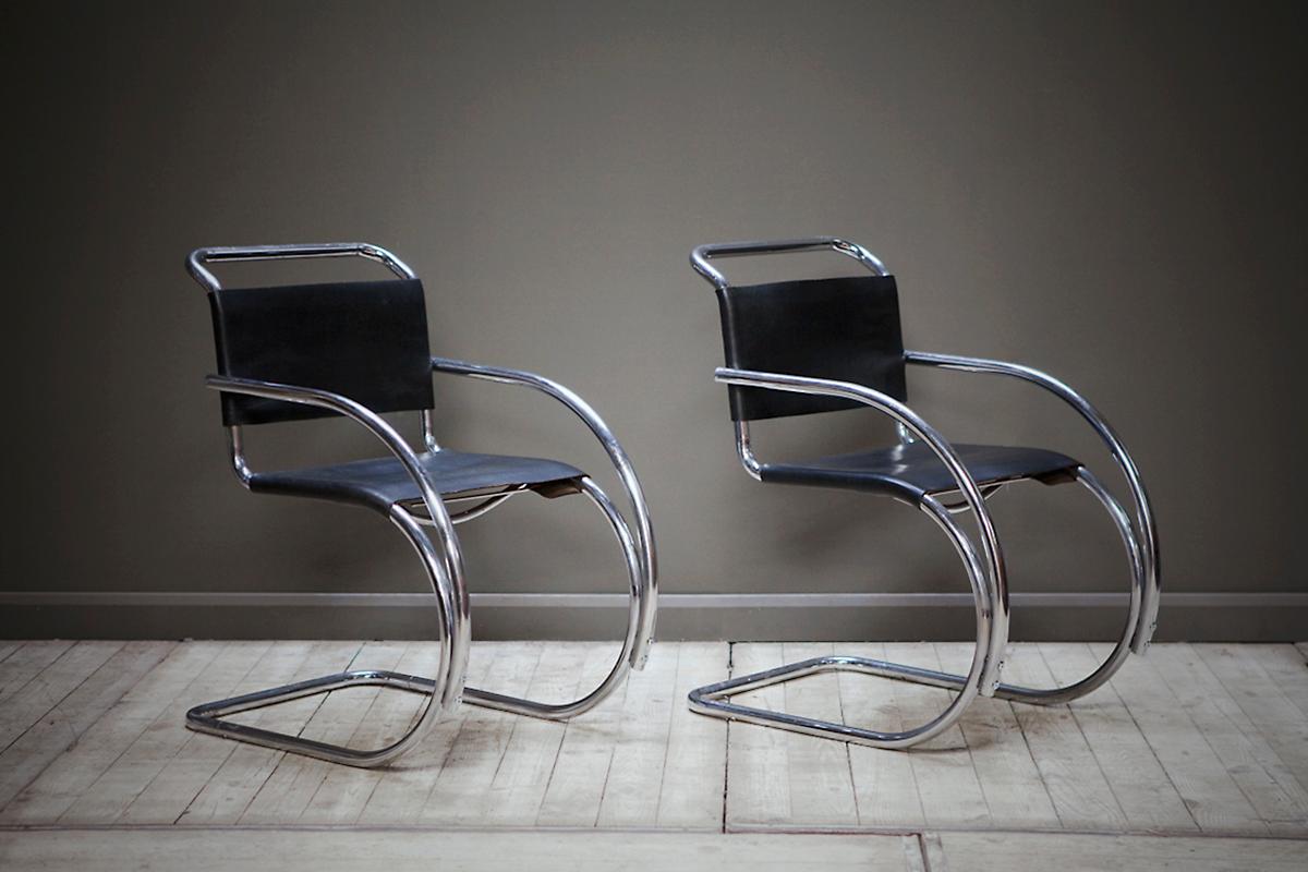 A pair of iconic MR20 armchairs - designed by German architect and furniture designer Ludwig Mies van der Rohe. Featuring a Classic and elegant chrome cantilever frame and original restored leather seats. The MR20 was designed in the 1920s. This