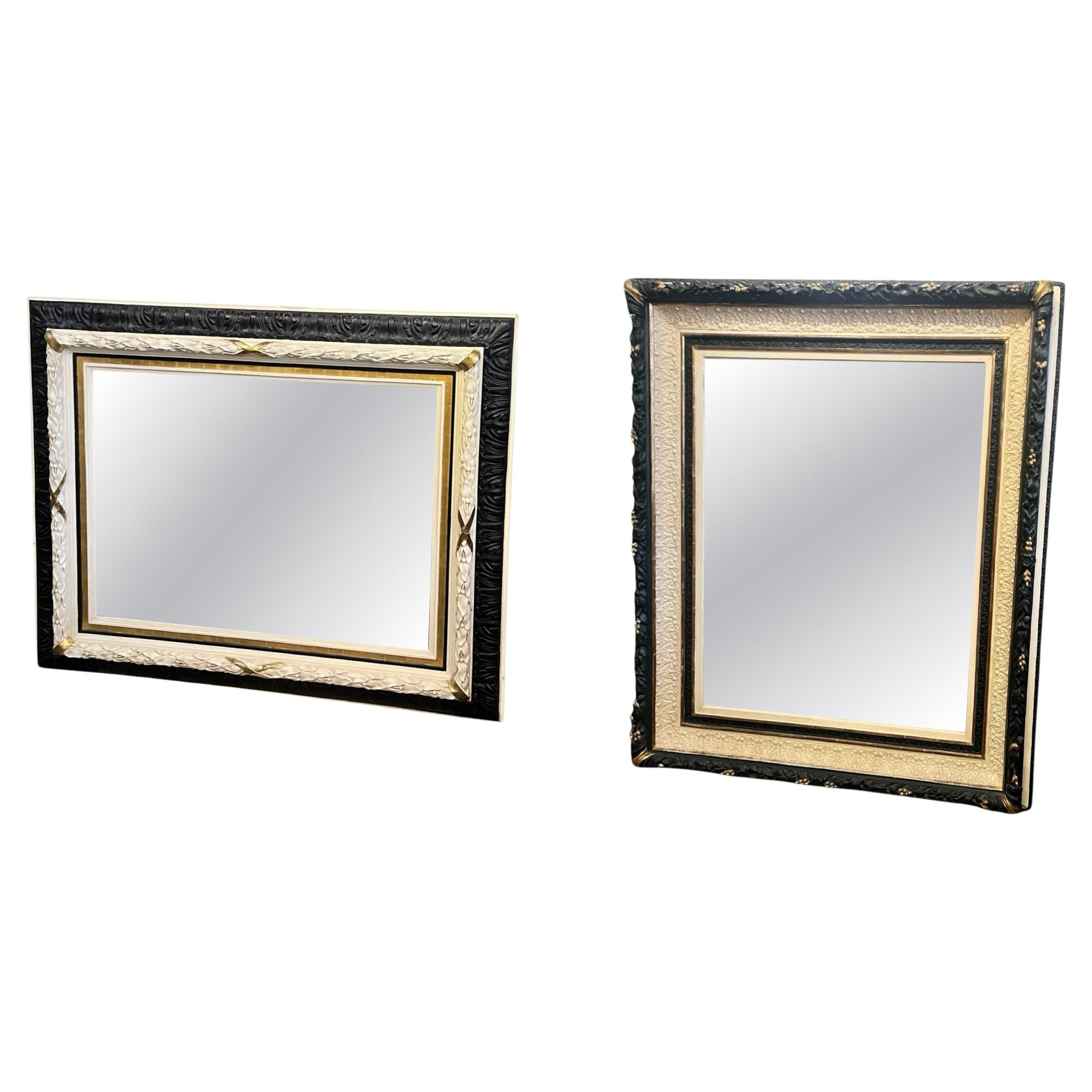 A set of two painted and gilt wall mirrors