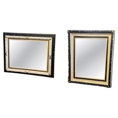 A set of two painted and gilt wall mirrors