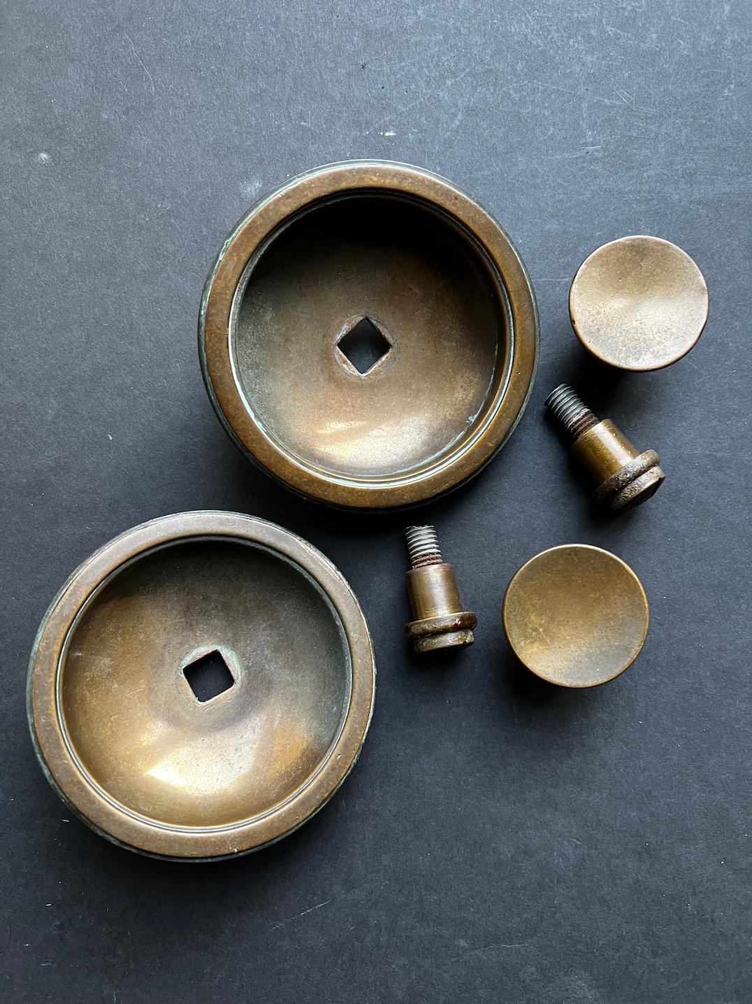 English A Set of Two Recessed Bronze Handles