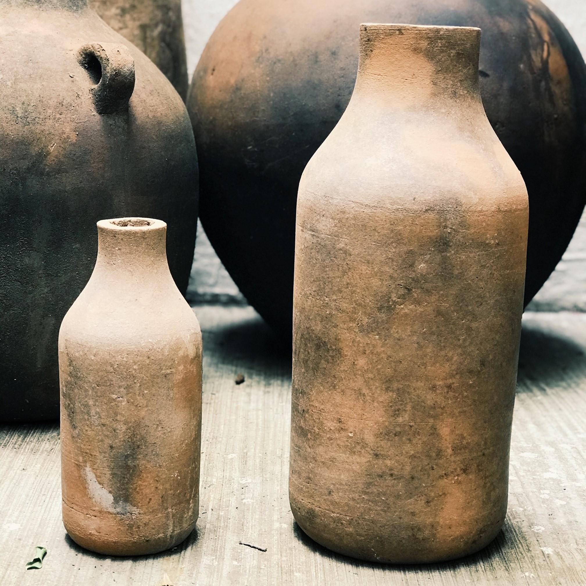 Los Pedritos are a set of vintage terracotta vessels discovered in a potters studio in region of Jalisco, Mexico. The part consist of one large and one small terracotta vessels that can make for great decorative interior accessories. 

Los