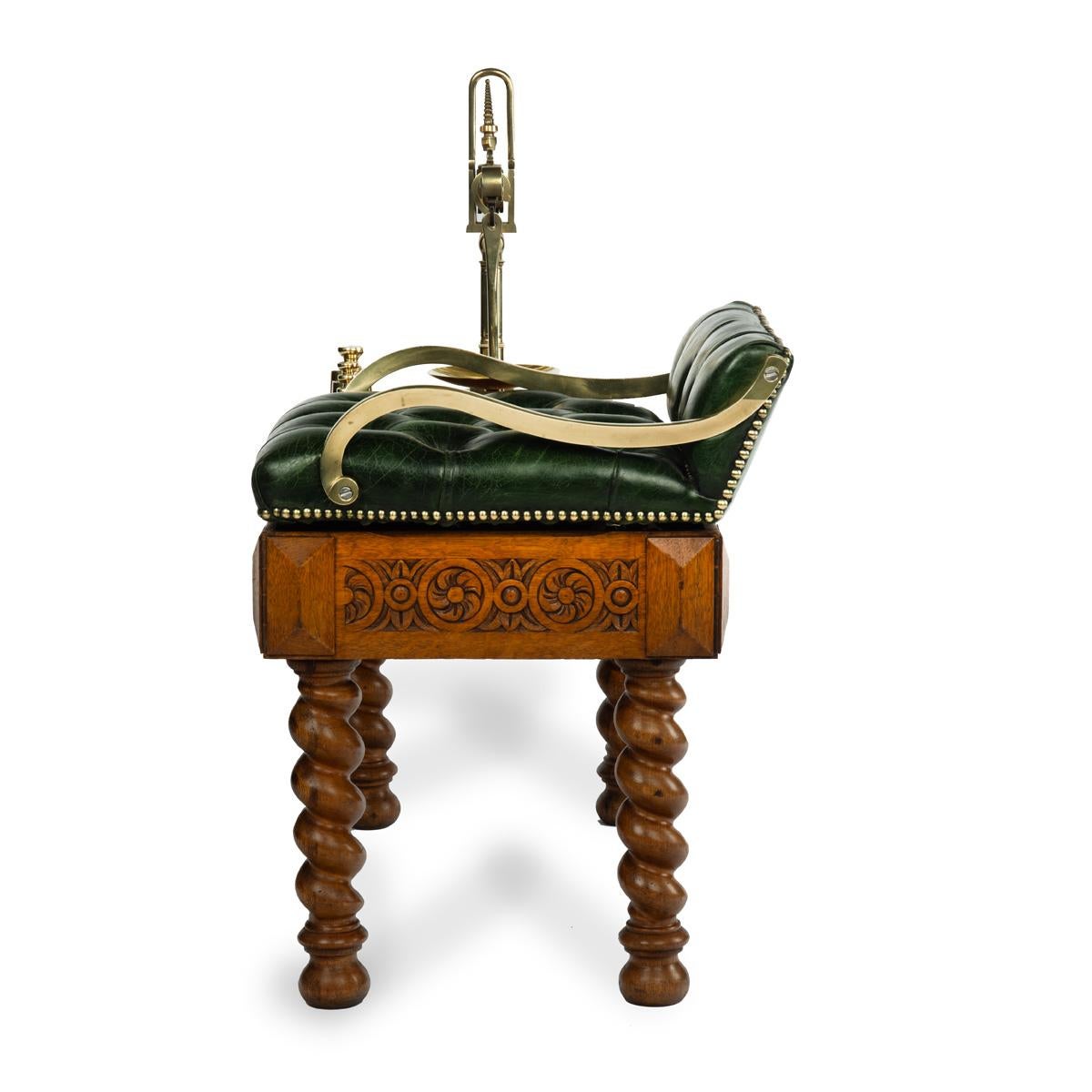 A set of Victorian oak Jockey scales by Youngs, of typical form with an upholstered seat adjacent to a brass balance, with four weights of 8, 4, 2 and 1 stone, the frieze with a carved rosette and leaf band, raised on four barley twist legs,