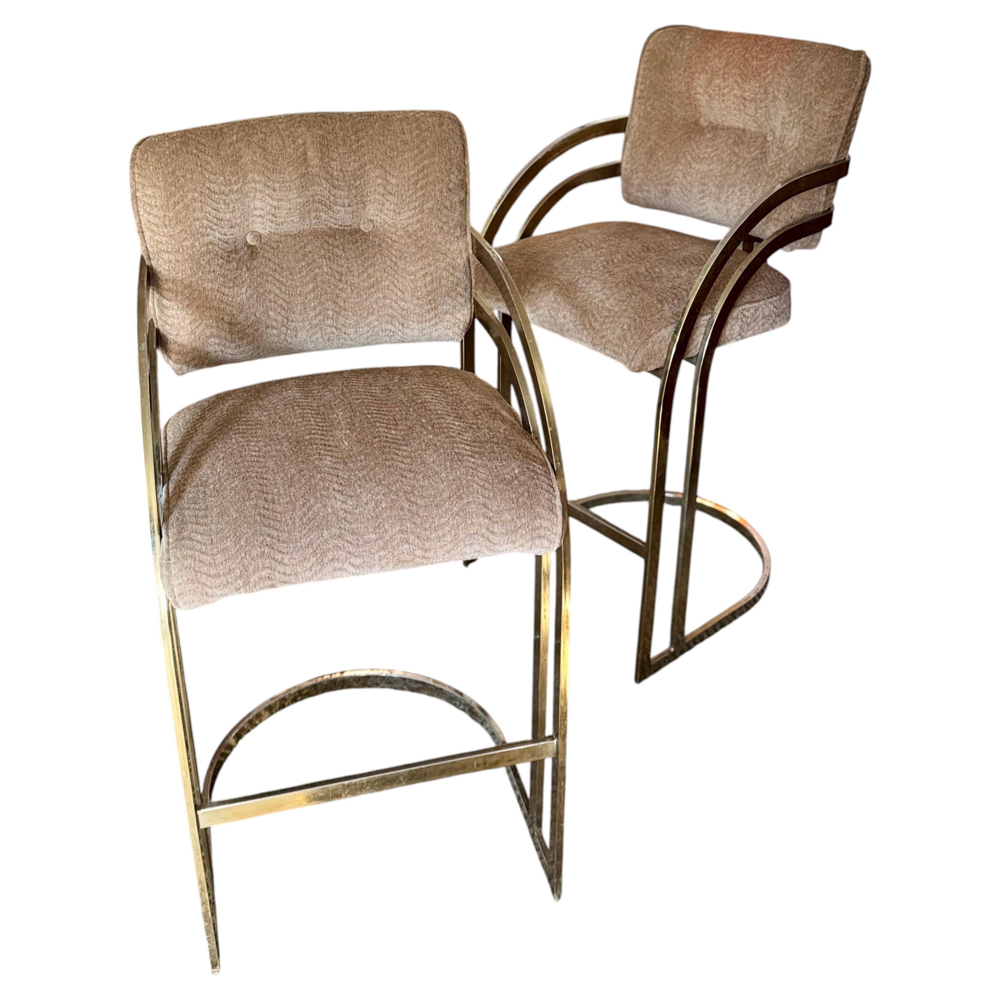 A set of vintage mid century cantilever bar stools in the style of Milo Baughman