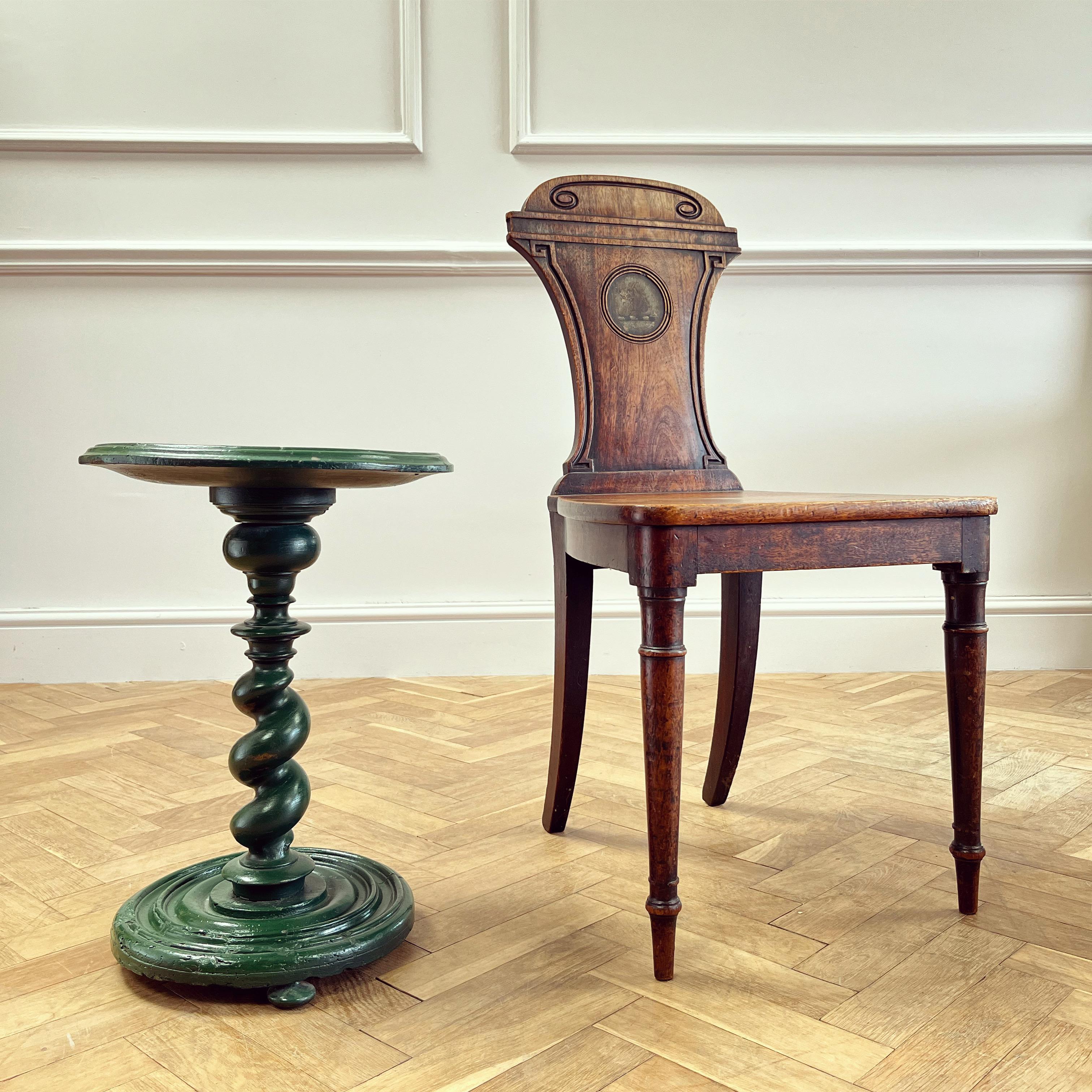 An occasional table with turned ciruclar top on single Solomonic column support and turned base with three bun feet - painted in a striking green gloss some time ago. Possibly yew wood.

English, Seventeen Century

H 48.5 x W 35.5 x D 35.5 cms

