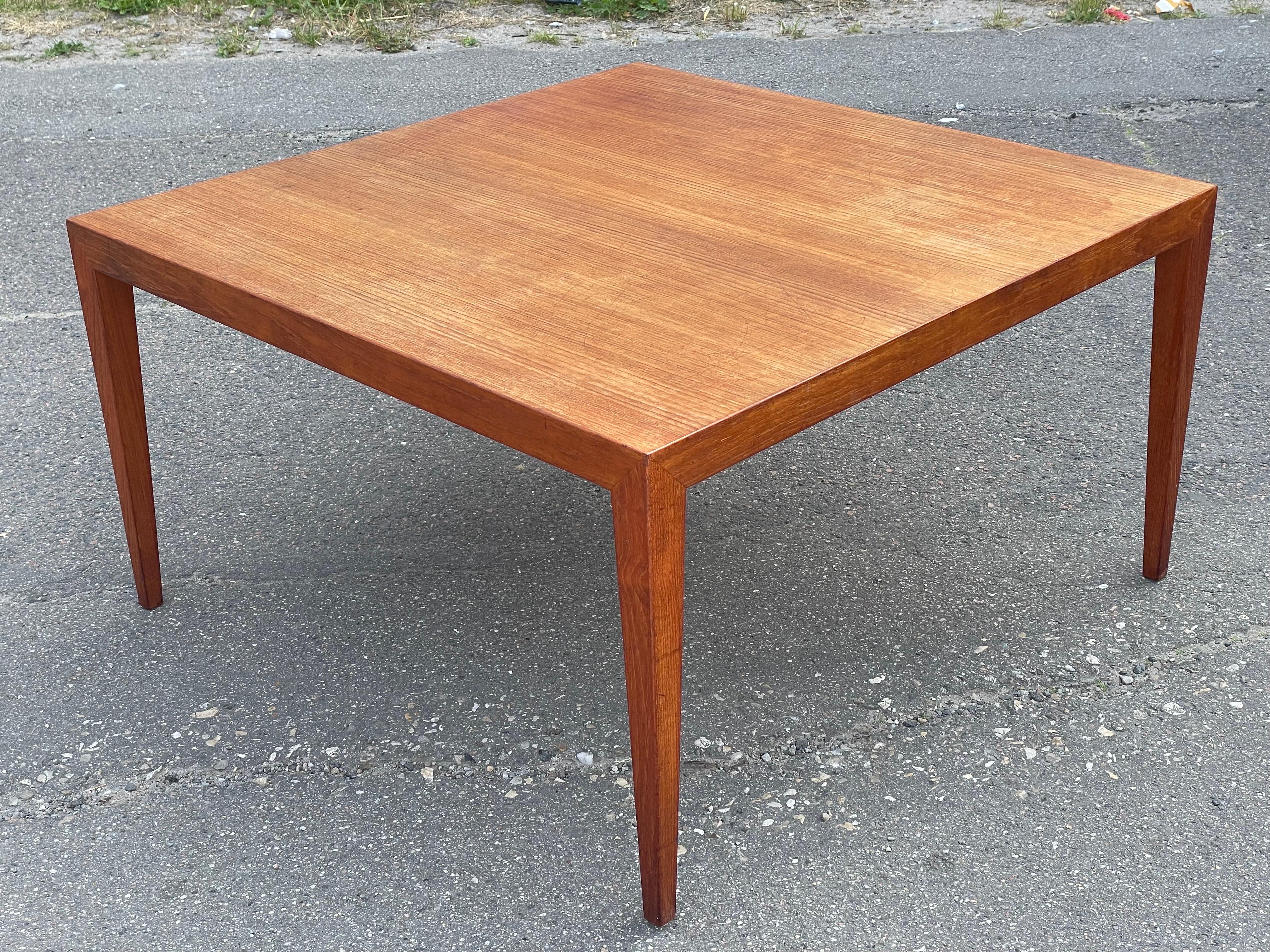An exquisite midcentury masterpiece: a teak coffee table designed by Severin Hansen and expertly crafted by Haslev Mobelsnedkeri, circa 1955. This stunning piece stands on elegant tapered legs, showcasing the epitome of Danish craftsmanship. The