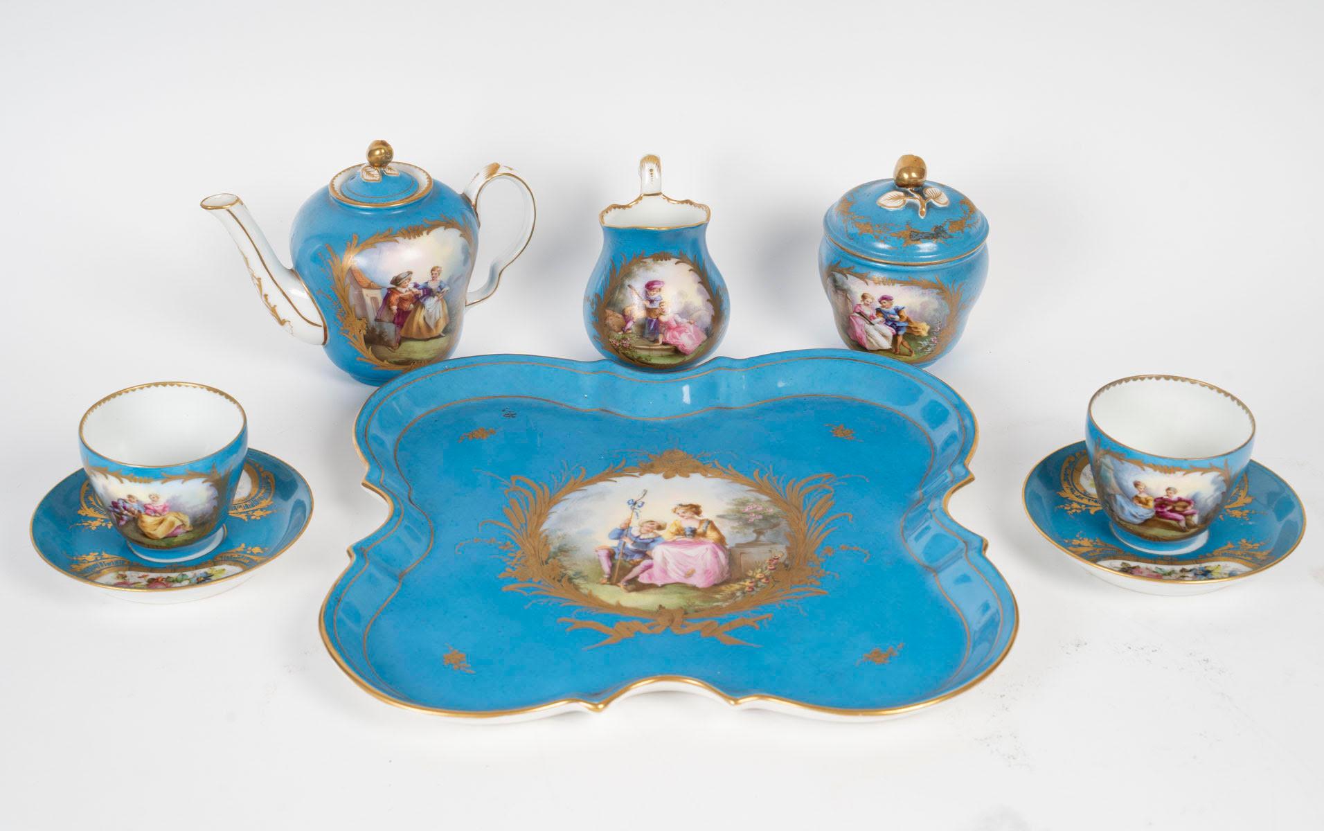 A Sèvres porcelain tea or coffee service, 19th century, Napoleon III period.

Tea or coffee service in light blue, gold and enamelled Sèvres porcelain, Napoleon III, 19th century.
Tray: H: 2cm, W: 30cm, D: 30cm
Cups: H: 7.5cm, D: 12.5cm
Teapot: H:
