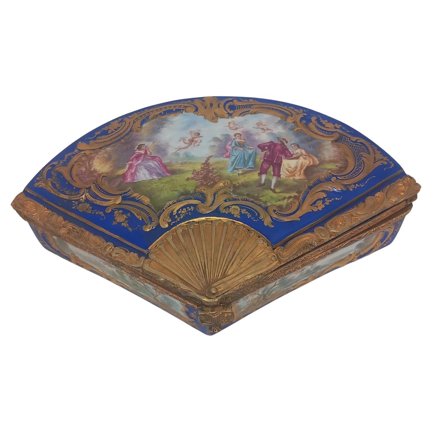 A Sèvres style antique French fan shaped porcelain jewellery box