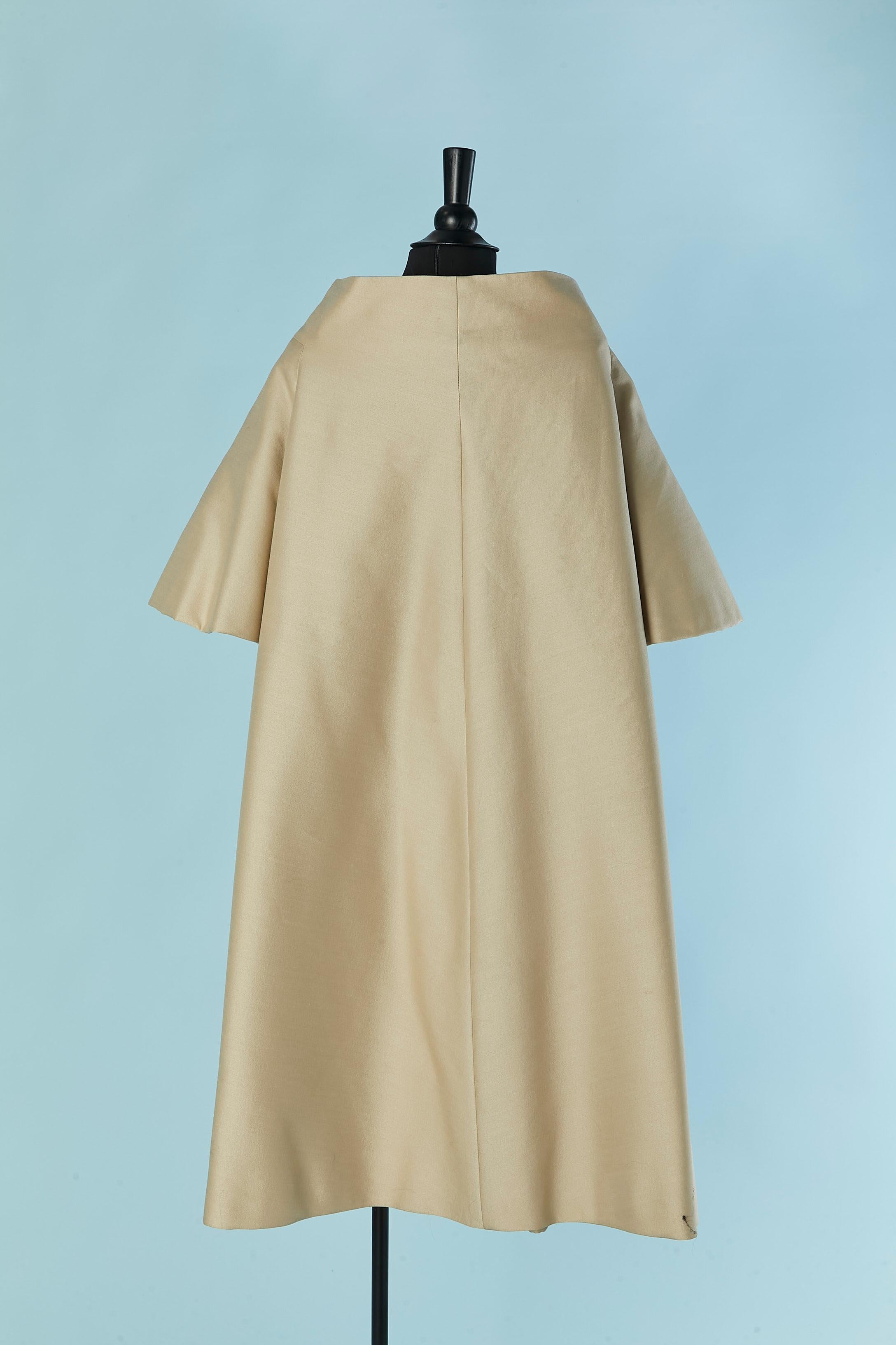 A shape beige coat with bow on the top middle front ADRIAN / PAULINE TRIGERE For Sale 1