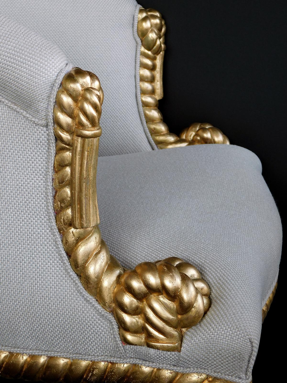 The barrel-back bergere with well-carved rope-twist frame all in the French Napoleon III style.