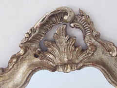 Shapely Venetian Rococo Style Silver-Leafed Giltwood Cartouche-Shaped Mirror