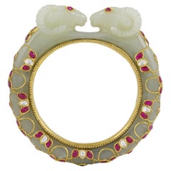 A sheep-head jade bangle in 22K gold rubies & diamond  Jewels from Mughal India