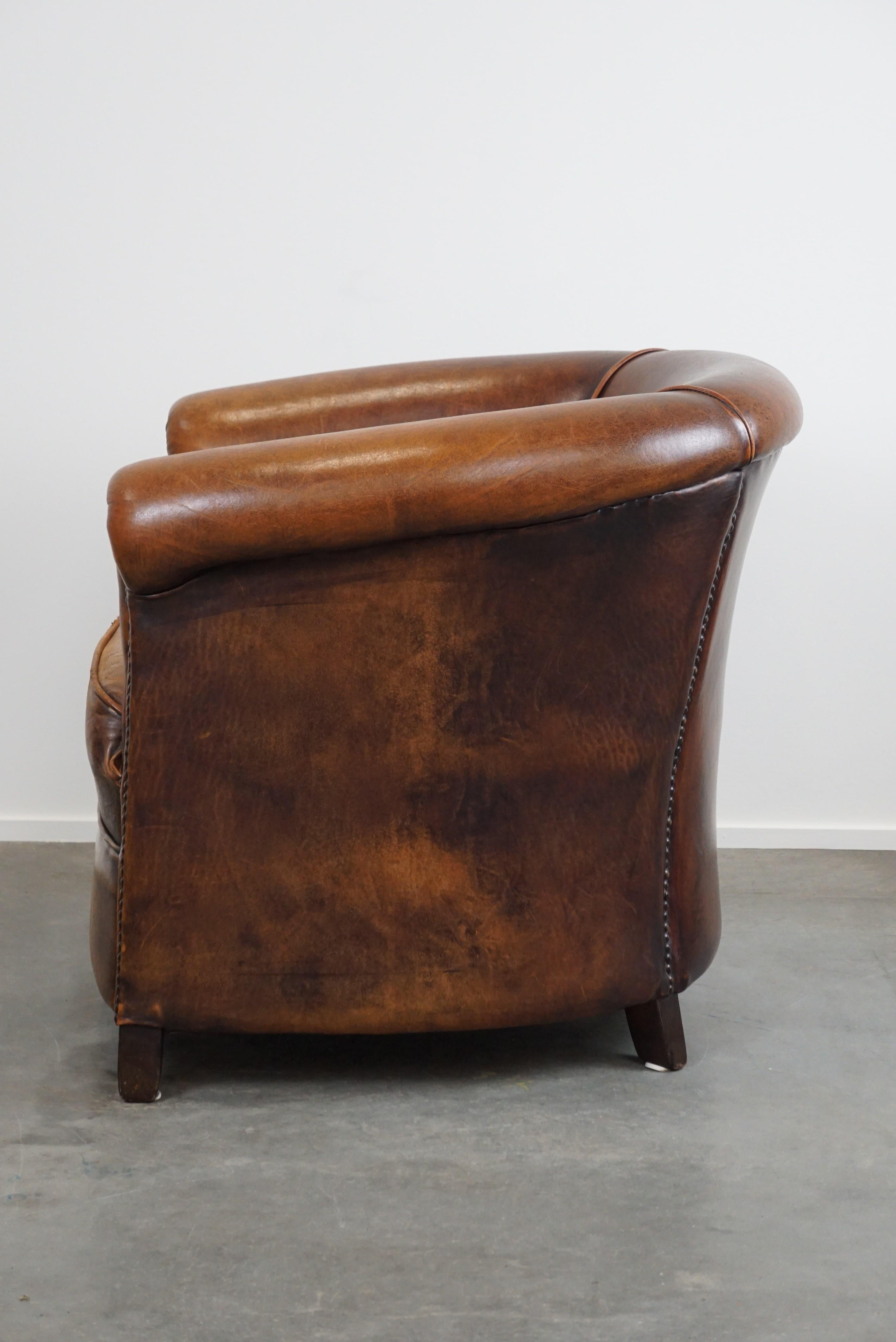A sheep leather club armchair in good condition, modest in size. In Fair Condition For Sale In Harderwijk, NL