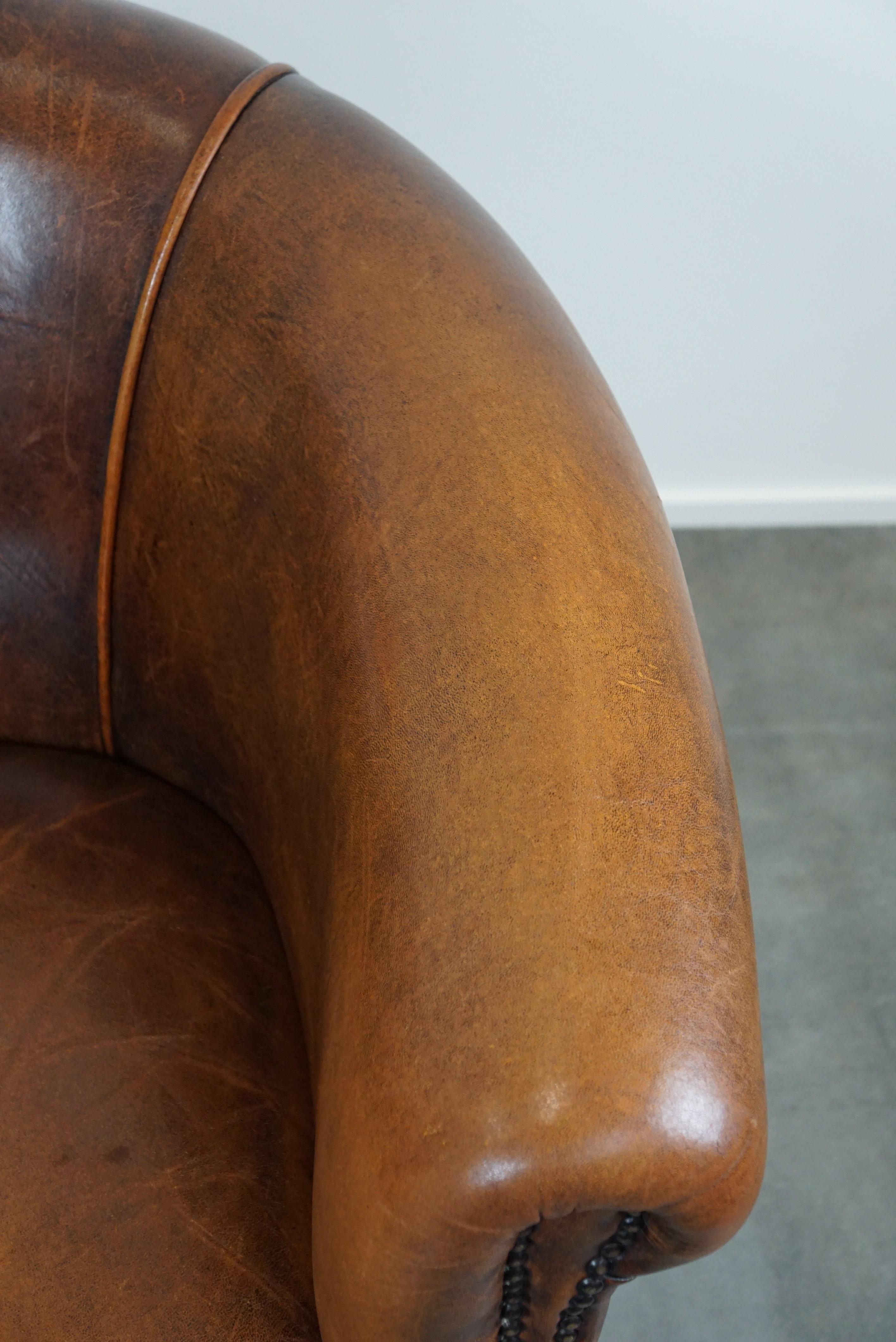 A sheep leather club armchair in good condition, modest in size. For Sale 1