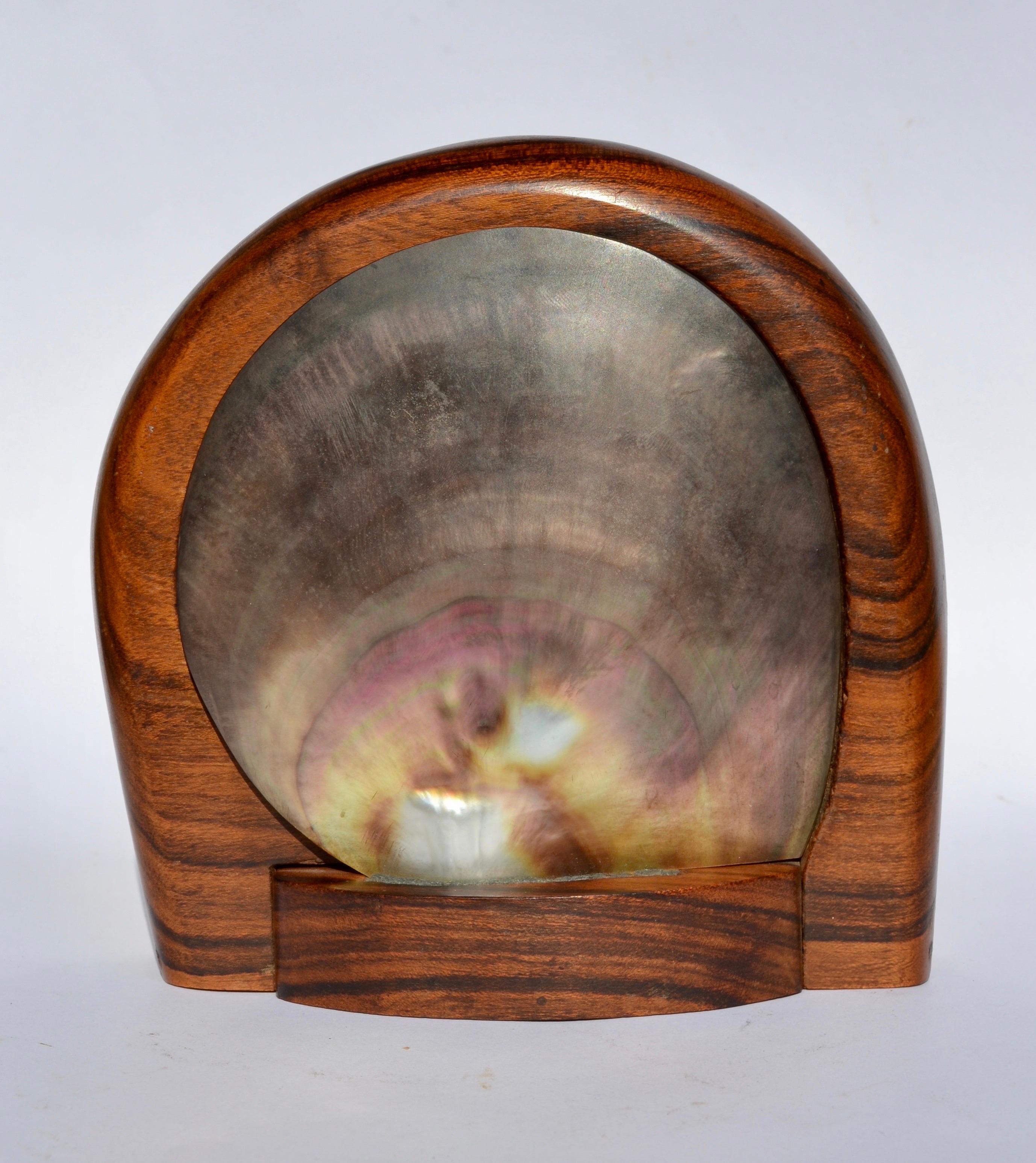 Hand-carved wooden box, attributed to Alexandre Noll, France, 1950s. Made from high-quality dark wood, it features sleek, organic lines. Its unique lid is a genuine polished shell, revealing the iridescent shine of mother-of-pearl.
