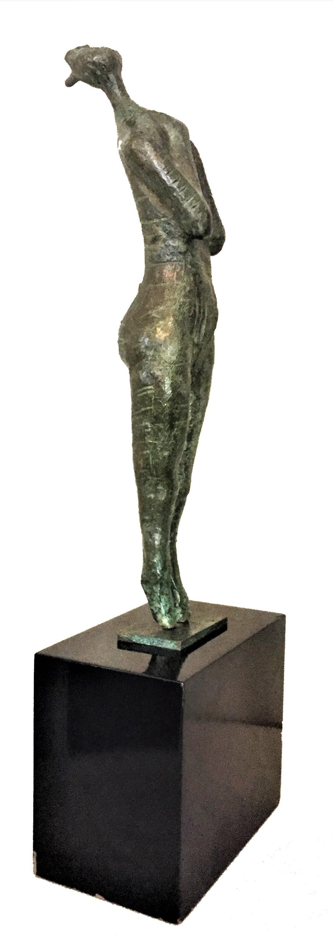 Signed “Igor ’67”, this beautifully cast patinated bronze sculpture depicts a woman on tiptoe, arms folded across h?? chest, head up and screaming with all her might, mouth wide open. Original lacquered wood base.

Dimensions:
Height (max):