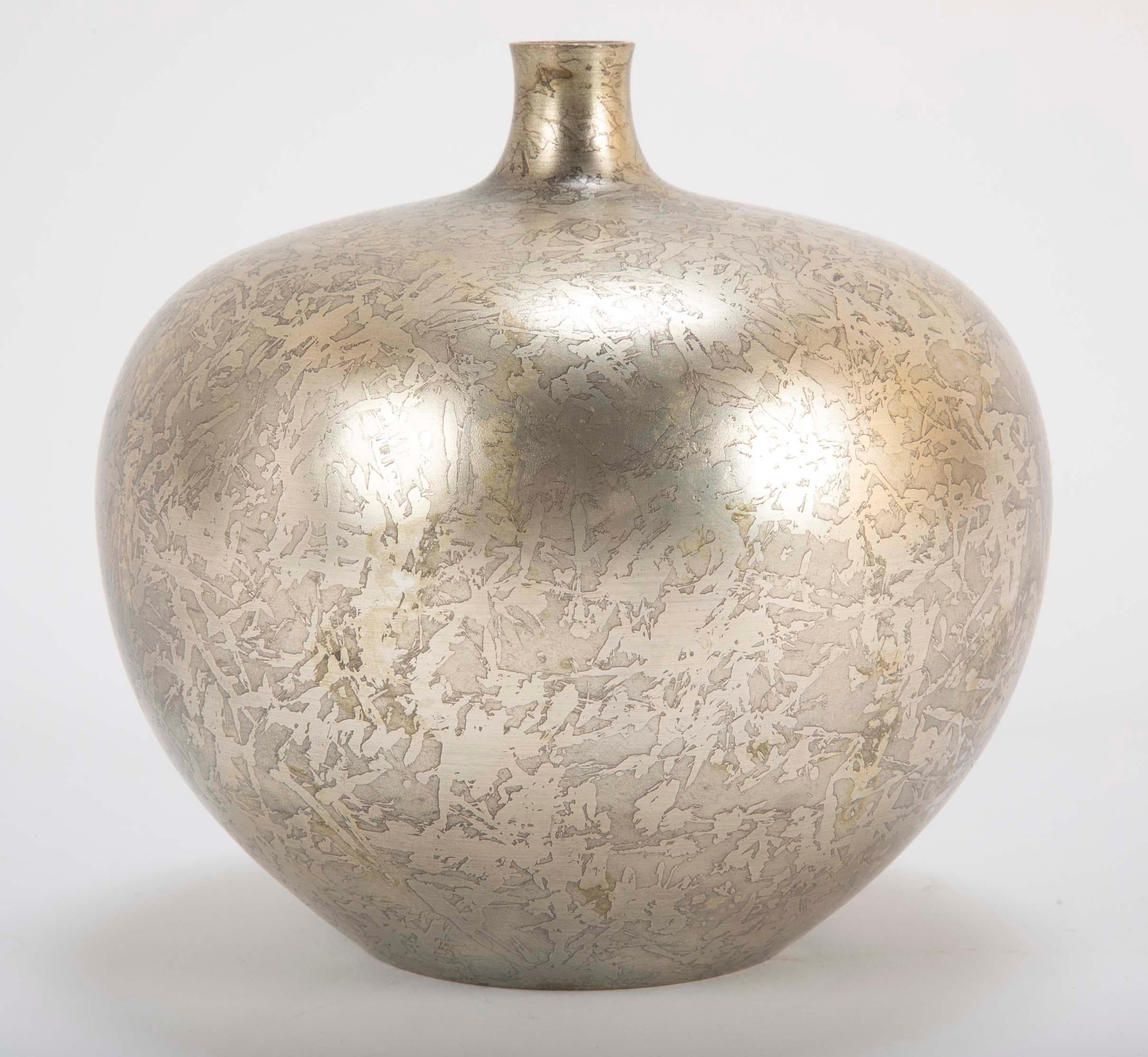 A Japanese silver overlay vase with textured finish. Singed with Fuku mark to underside. Vases is sold with Tomobaco (wooden storage box with signature and title). Vase has no dents or scratches.
