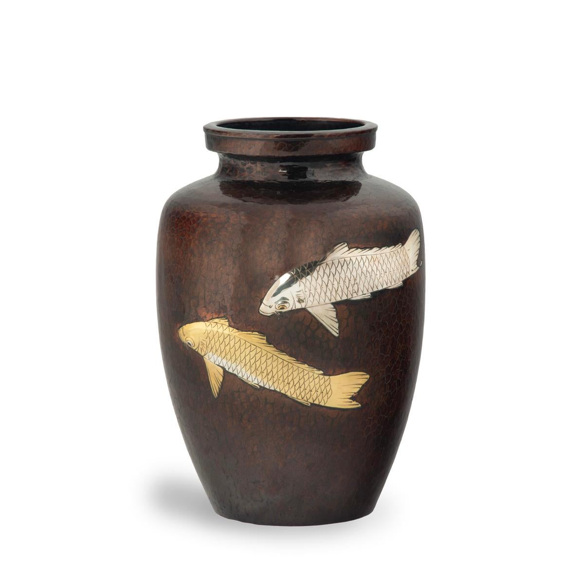 A Showa period lacquered metal vase, decorated with one silvered and one gilt carp on a planished ground, signed.  Japanese, c1930.
