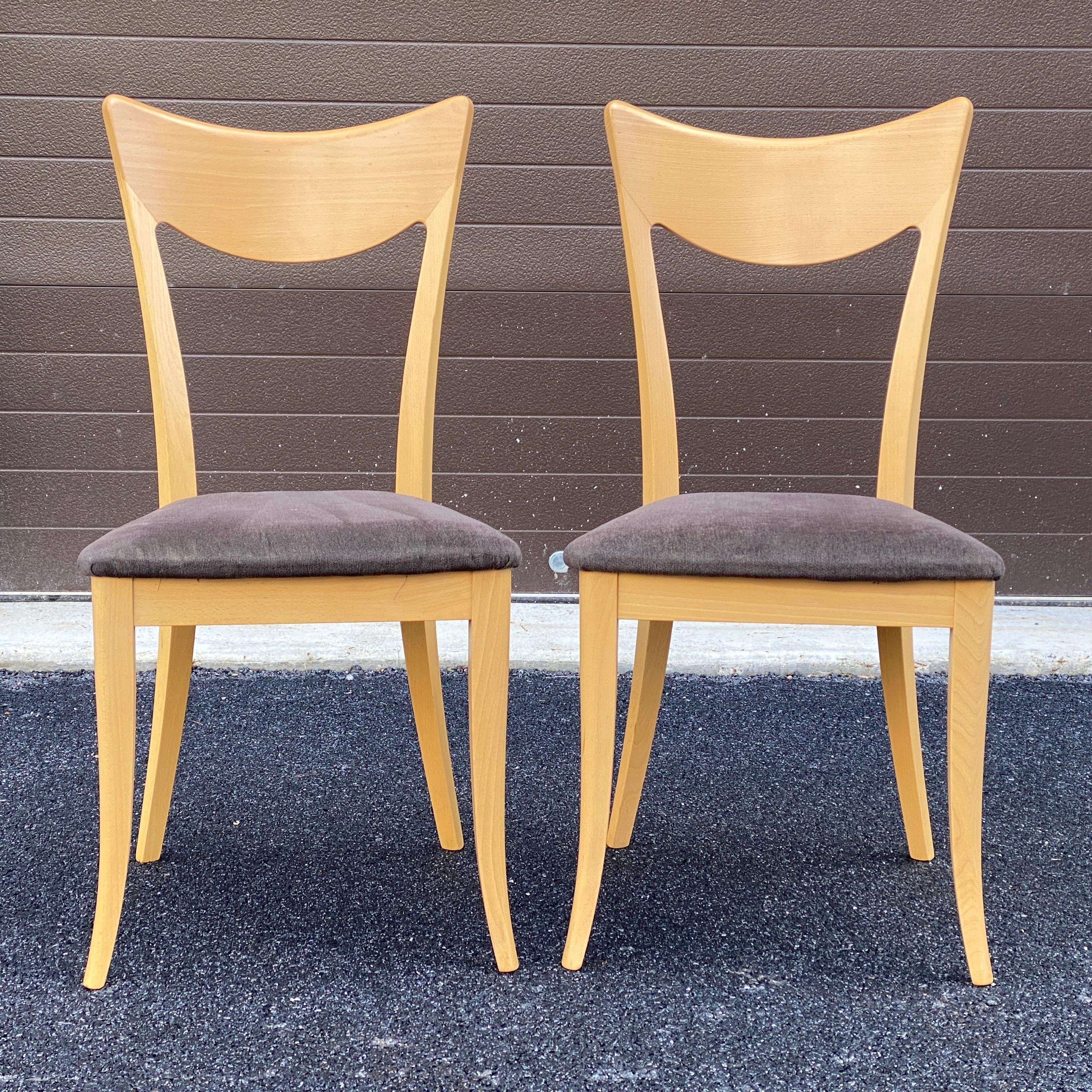 A nice pair of dining side chairs made in Italy by A. Sibau featuring sculptural natural hardwood frames with flared legs and attached upholstered seats. 