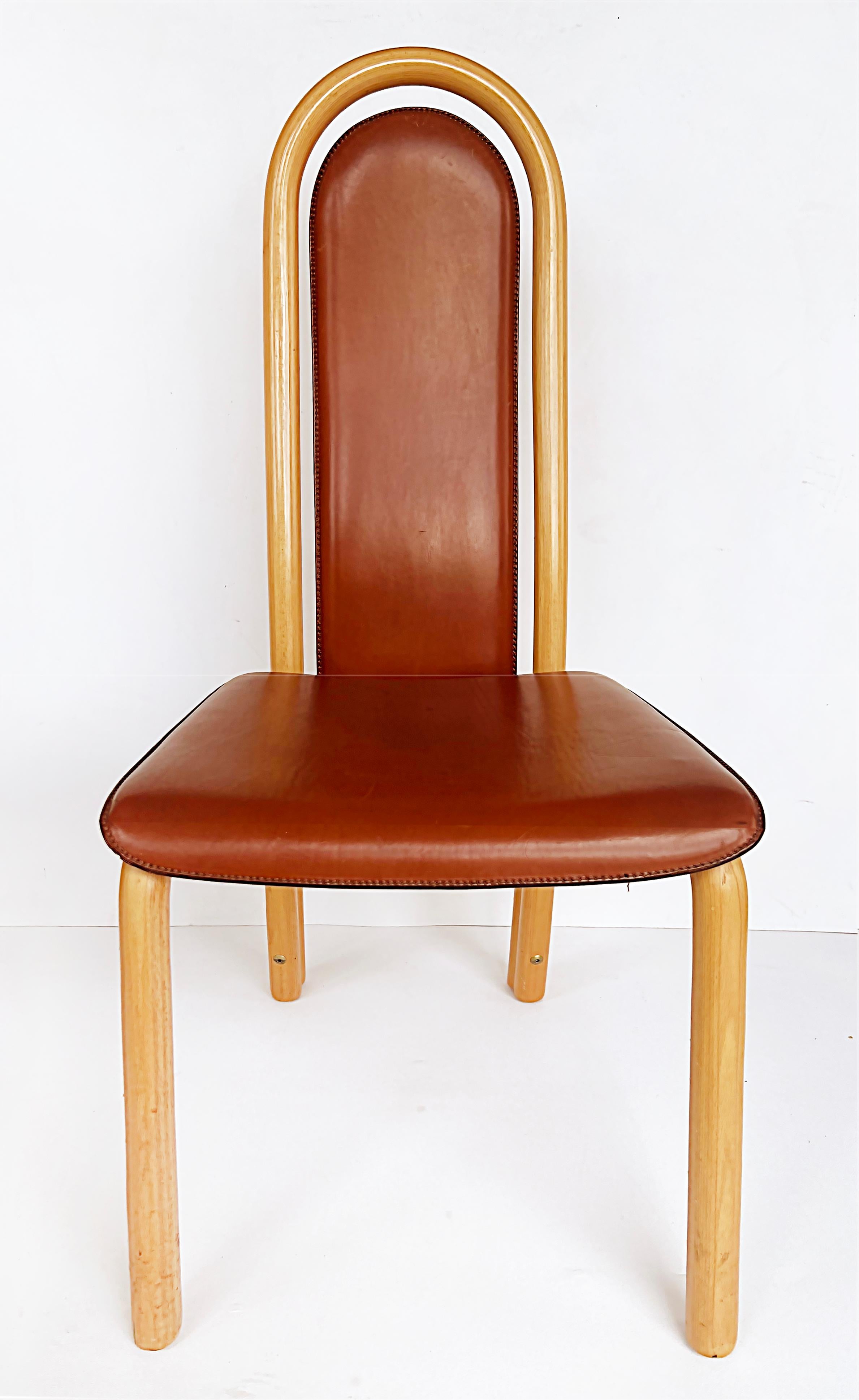 A. Sibau Italian Postmodern Stitched Leather Dining Chairs, Set of 6

Offered for sale is a set of 6 Postmodern A. Sibau Italian wood and leather dining chairs.  The chairs are heavy as they are substantially constructed in what we believe is
