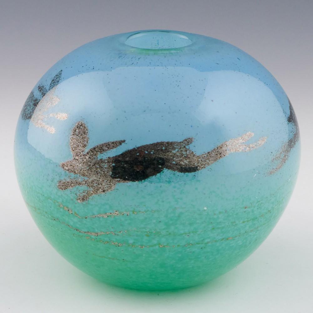 A Siddy Langley studio glass vase signed and dated 2022 made in Cullompton, Devon. The bowl features hares leaping over a field.

607 grams.

Made 50 years after Watership Down was first published, it reminded us all of the film. We appreciate