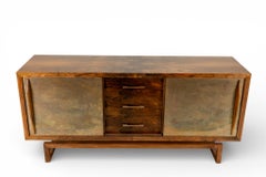 A Sideboard with Brass Covered Sliding Doors