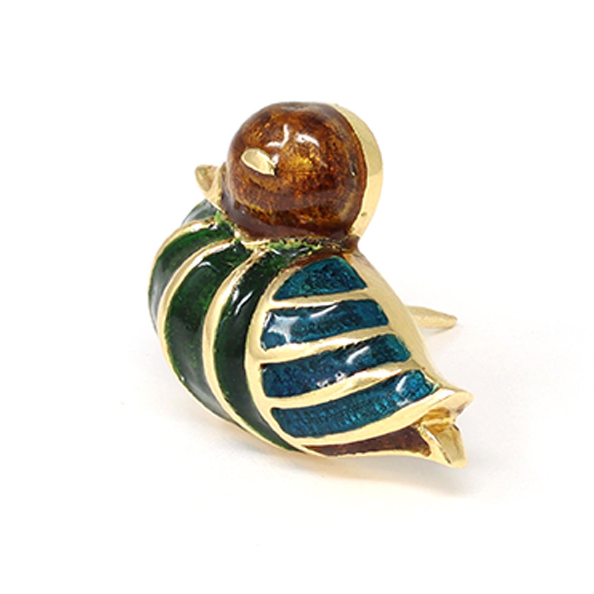 A one a kind vintage duck pin signed by the iconic house of jewelry Boucheron Paris. The elegant pin features an 18 karat yellow gold enameled little duck in green and blue stripes. It is signed and numbered and has a gross weight of 6 grams. It