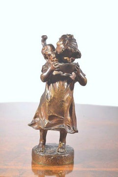 Signed Bronze Figure of a Girl Holding a Kitten