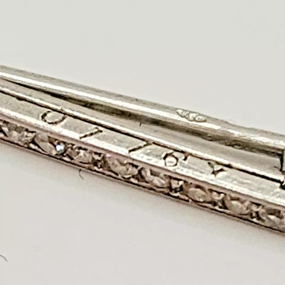 A Signed Cartier Paris Art Deco Platinum & Diamond Pin / Brooch, Circa 1920’s. 

An Fine quality original art deco Diamond Brooch circa 1920s signed Cartier Paris.

This superb brooch is four claw set, with seventeen eight cut diamonds.

This is a
