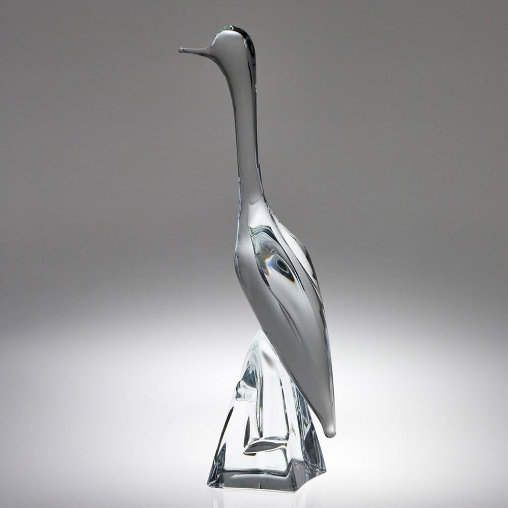 This monumental Daum animal glass sculpture depicts a perched cormorant or an egret. Made in 3 sizes this is the tallest available. 

When Jean Daum assumed control of the Verrerie Sainte-Catherine, after the previous owners defaulted on their